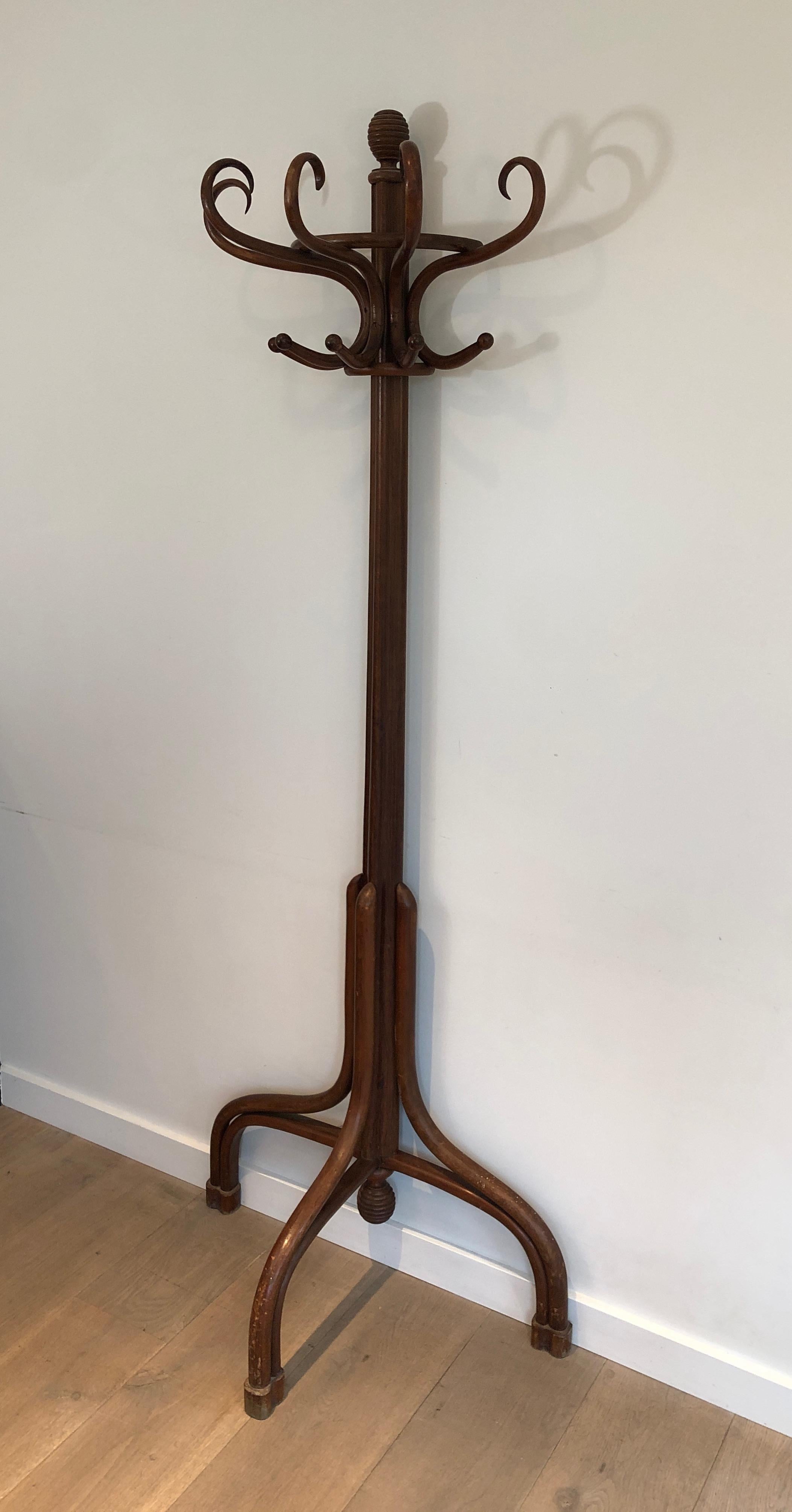 This very unusual half-moon parrot coat hanger is made of wood. This is a work in the style of famous Austrian designer Thonet. circa 1900.