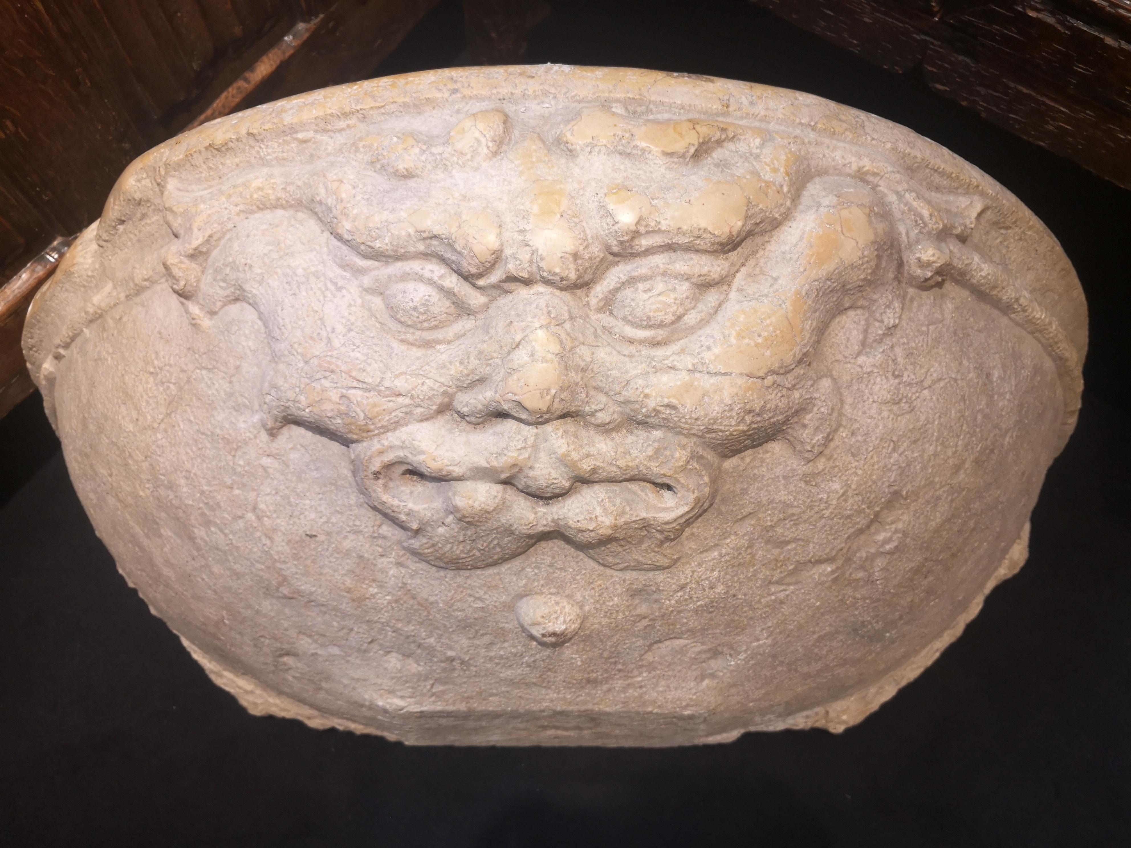 HALF-MOON STOUP

ORIGIN: VENICE, ITALY

PERIOD: 13th Century

Height: 33 cm
Width: 82 cm
Depth: 55 cm

Nembro marble 

This hemispherical stoup is powerfully carved with a mascaron with strong features, frowning eyebrows, a strong nose and grimacing