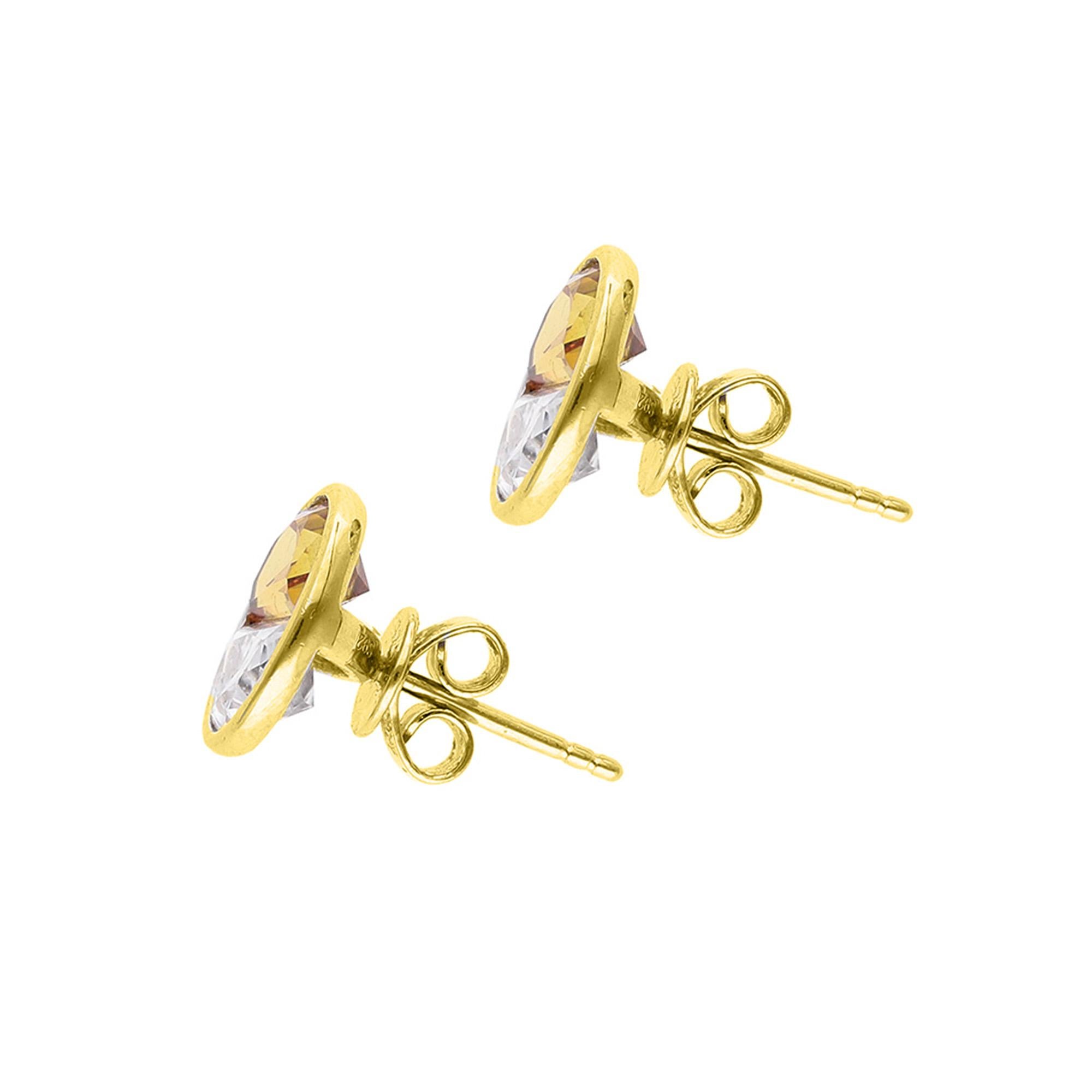 These studs feature two rare, half moon cut yellow sapphires and moissanite in a tension setting. The contrasting colours allude to the yin yang, the ancient symbol of harmony and balance. This pair of studs shine brightly.  

Details:

Available in
