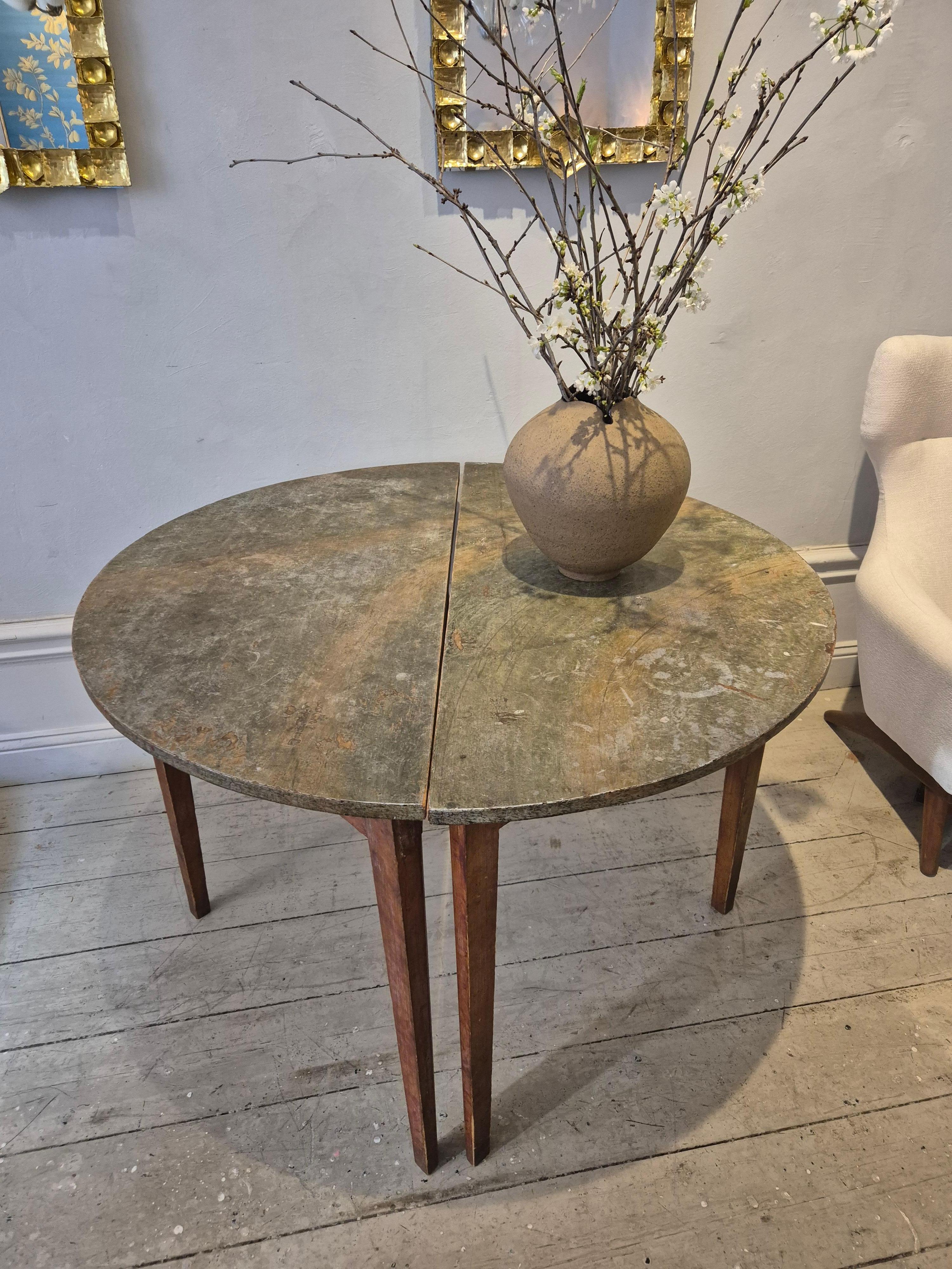 A pair of half moon / demi lune tables with original marbled top (painted to look as marble, typical for Allmoge), Swedish provincial style / Allmoge. 

Size as round table: diam 120 cm. Size as concole 120x60 cm. 

Provenance :Flybo, Åseda Småland,