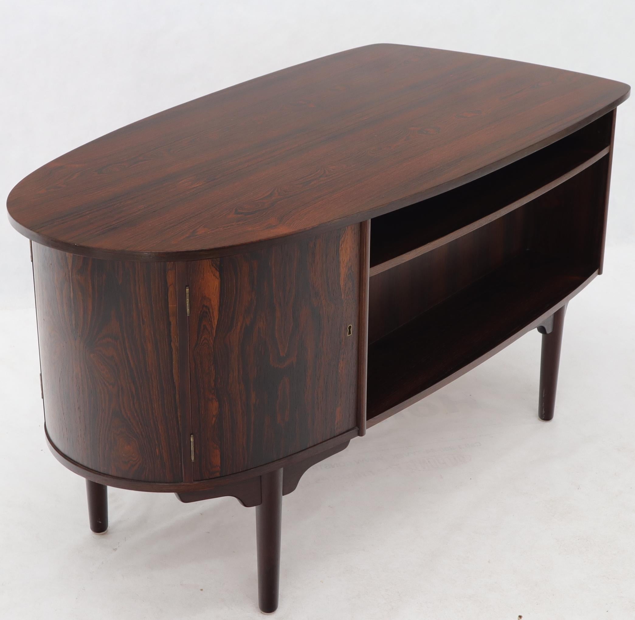 Danish Mid-Century Modern half oval desk with a bookcase and a drum shape side or curve.
 