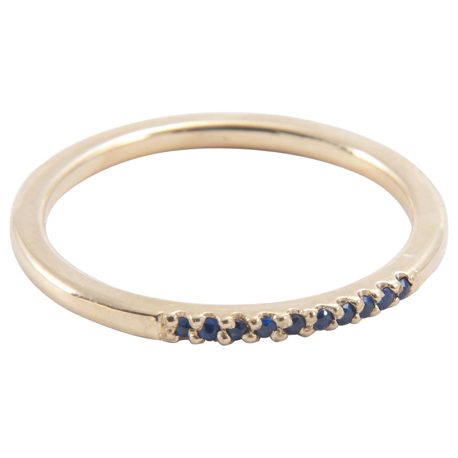 Adding a subtle pop of color, this ring is the perfect addition to a stack, or a simple statement on its own.

18K yellow gold band encrusted with pave set 0.03” blue sapphires.