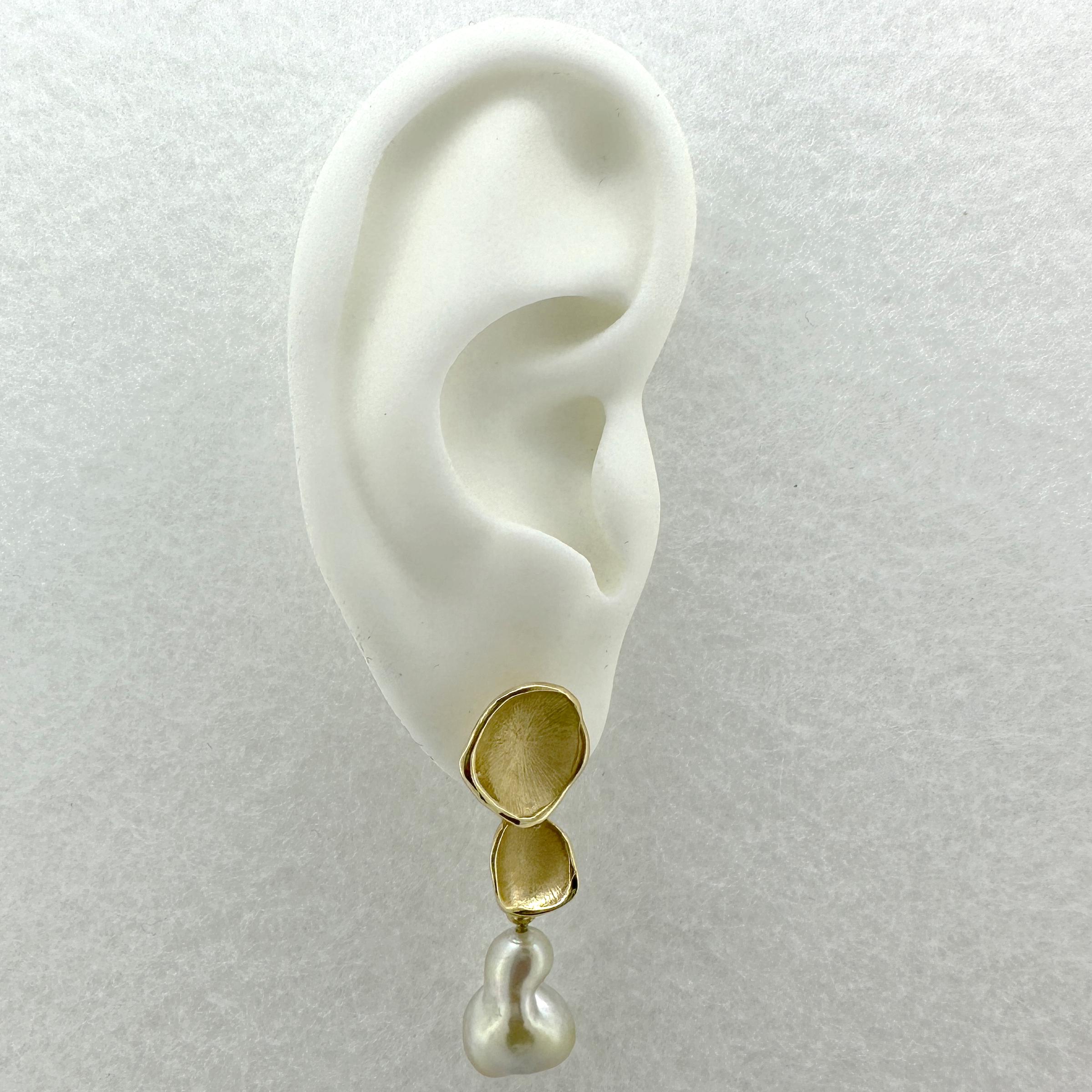 These gorgeous new earrings by Eytan Brandes feature stylized leaves of the peperomia succulent cast in 18 karat gold.  He's used this design for earrings and pendants, but usually in a long cascade of five to eight leaves in graduated sizes.  For