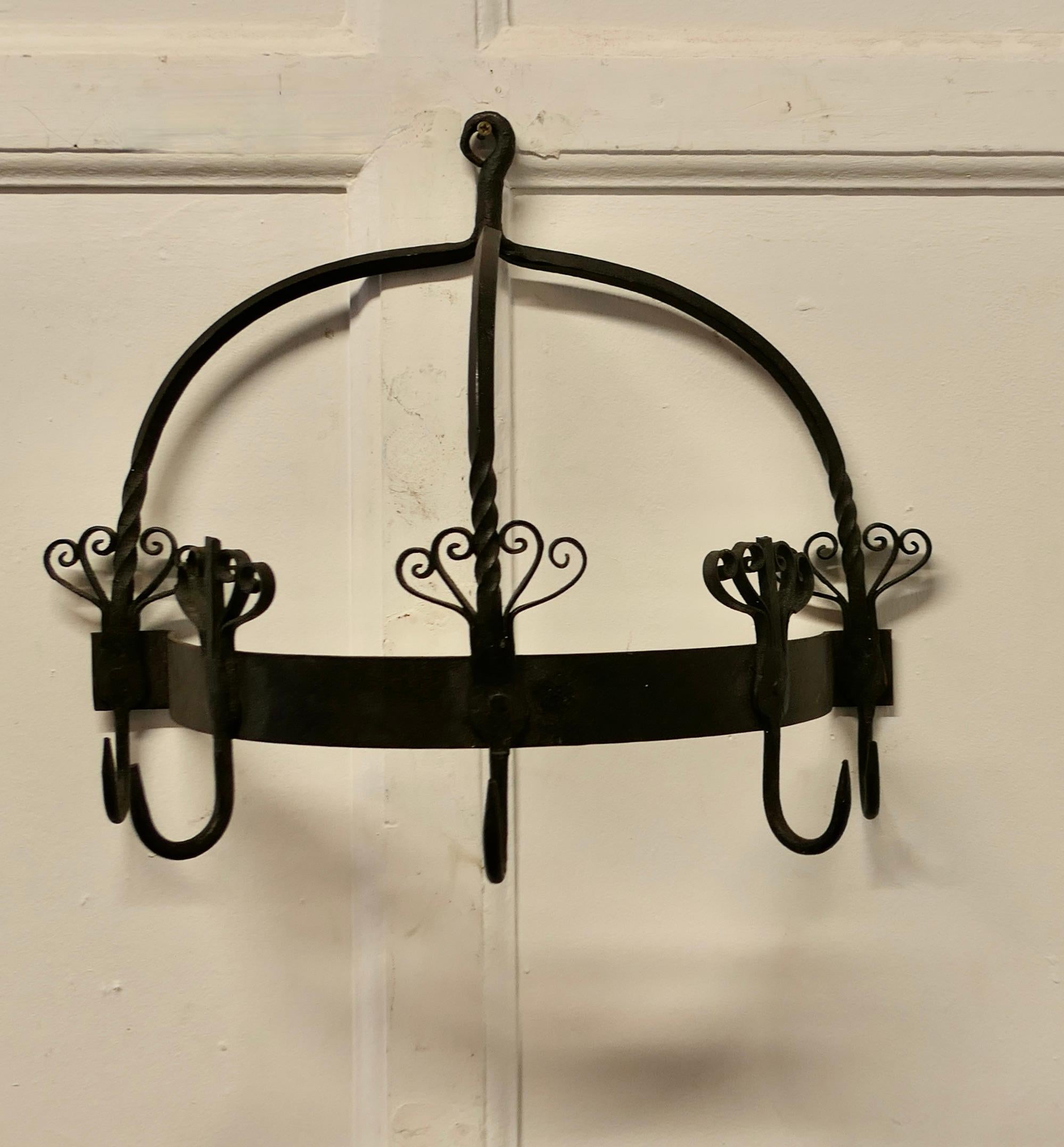  Half Round Blacksmith Made Iron Game Hanger, Kitchen Utensil Hanger

A great piece it is a half round shape with 4 large hooks, it sits flat on the wall, if you don’t need it to hang your game on how about your pots or kitchen utensils
The hanger