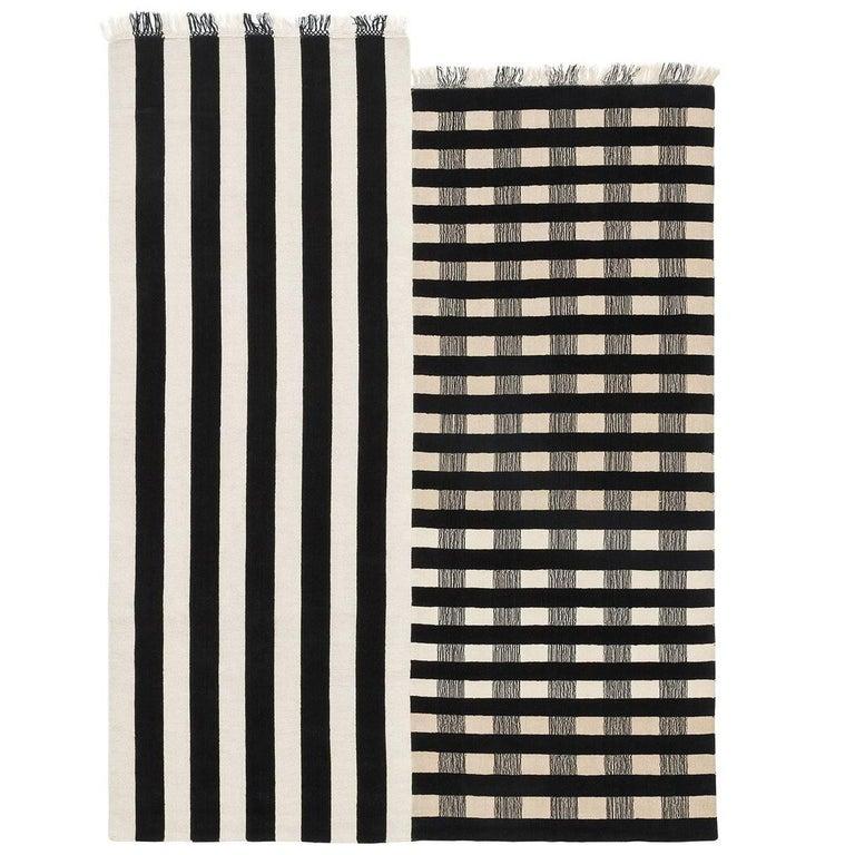 The design of this unique carpet is inspired by pieces of fabric in which contrasting lines are combined to created striking graphic compositions. These bold and minimalist decorative patterns are traditional of abstract decorations from west