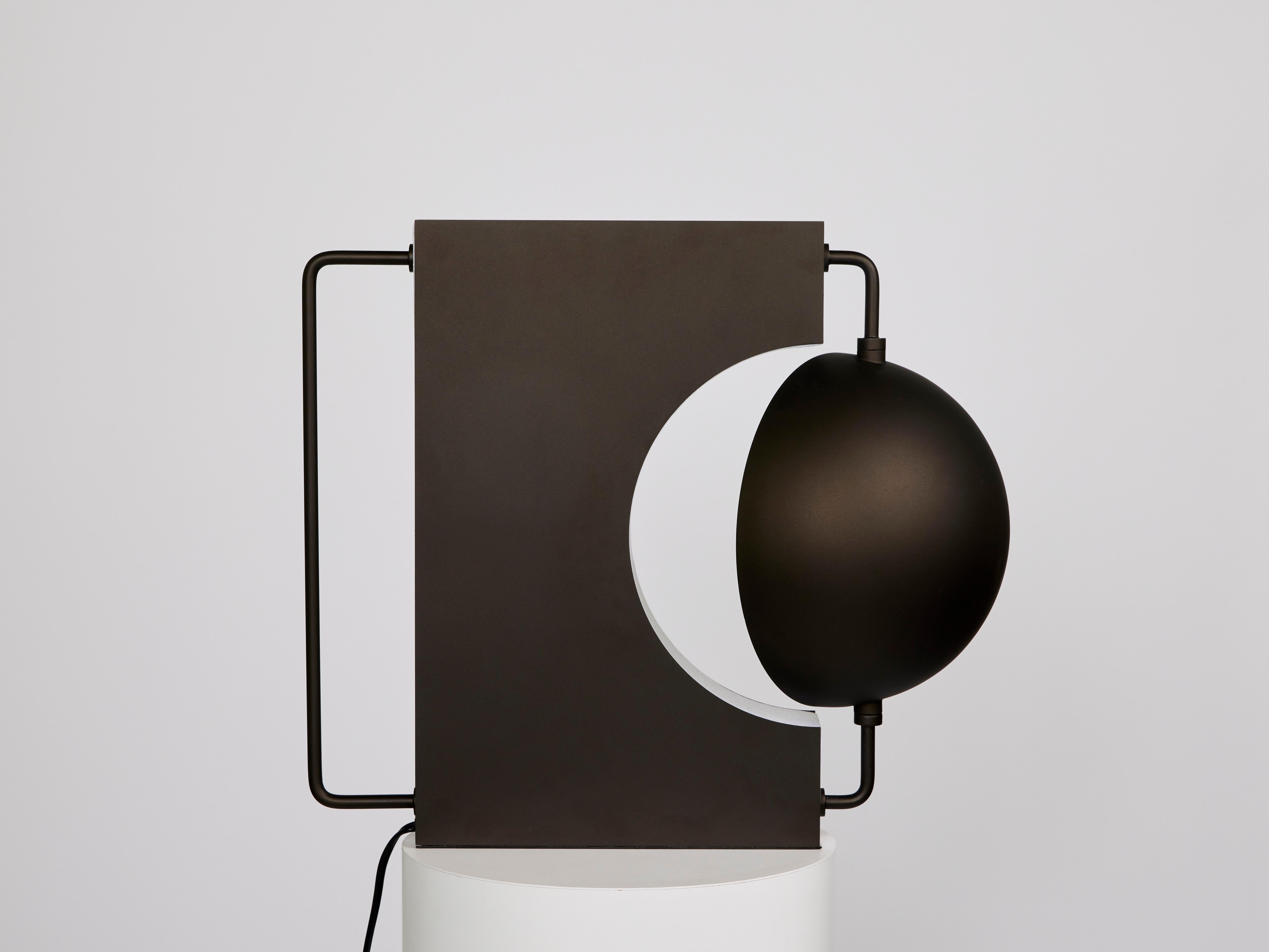 Half Table Lamp (Black)

Materials: powder-coated golden black 
Dimensions: W20 x D11 x H17 inches
Lamping: G9 2700K/3000K dimmable, UL Listed.


A table lamp that plays with contrasting elements of roundness and sharpness, darkness and