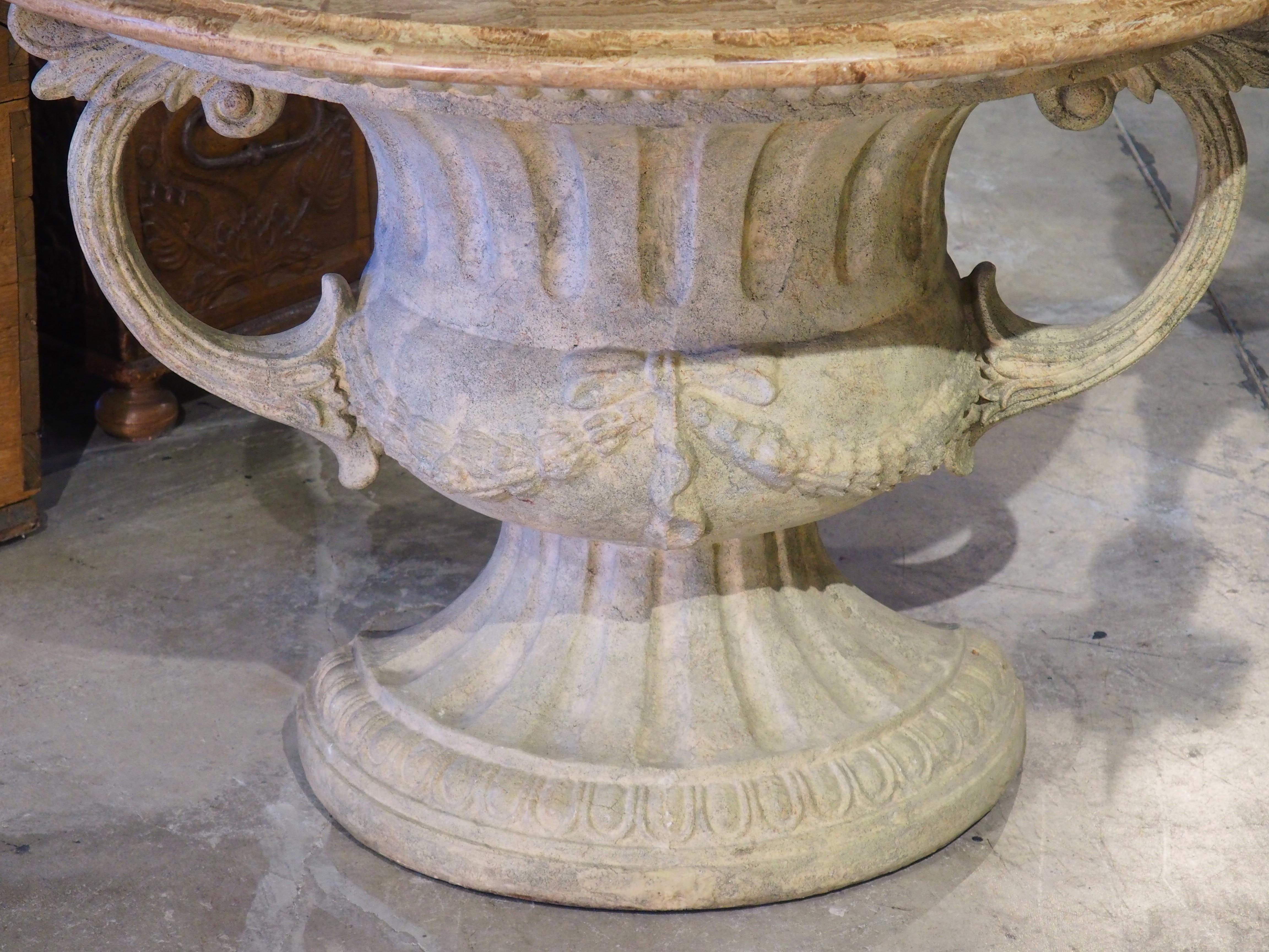 Reminiscent of a campana (bell-shaped) urn, this demi lune console table features a Neoclassical style, molded base. Consisting of a fluted body, the half urn has been painted to mimic antiquity, including hues of gray, green, and cream. A pair of