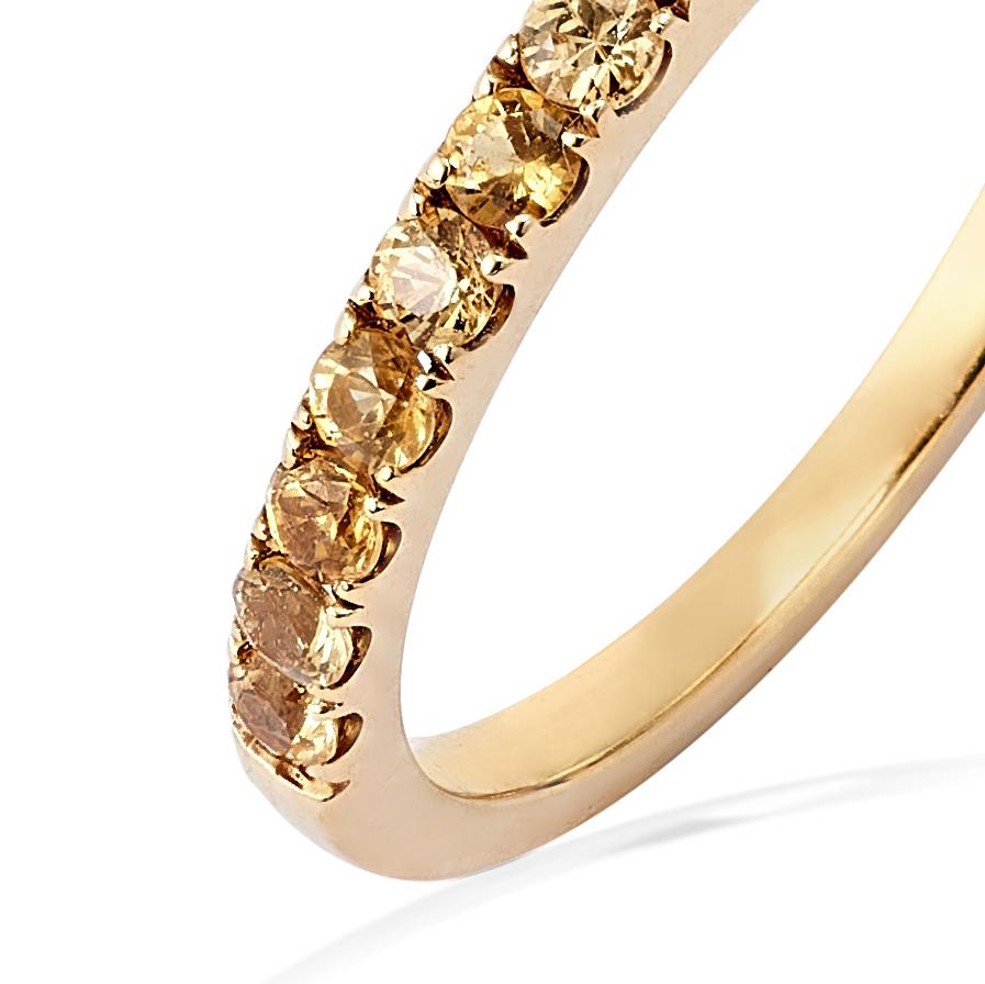 A medium 18K Yellow Gold band ring set with stunning Yellow Sapphires by Barbara Harris Water Jewels. 

Subtle and delicate like a soft whisper, our Half Whisper rings are perfect worn as an individual accessory or stacked with other rings to create