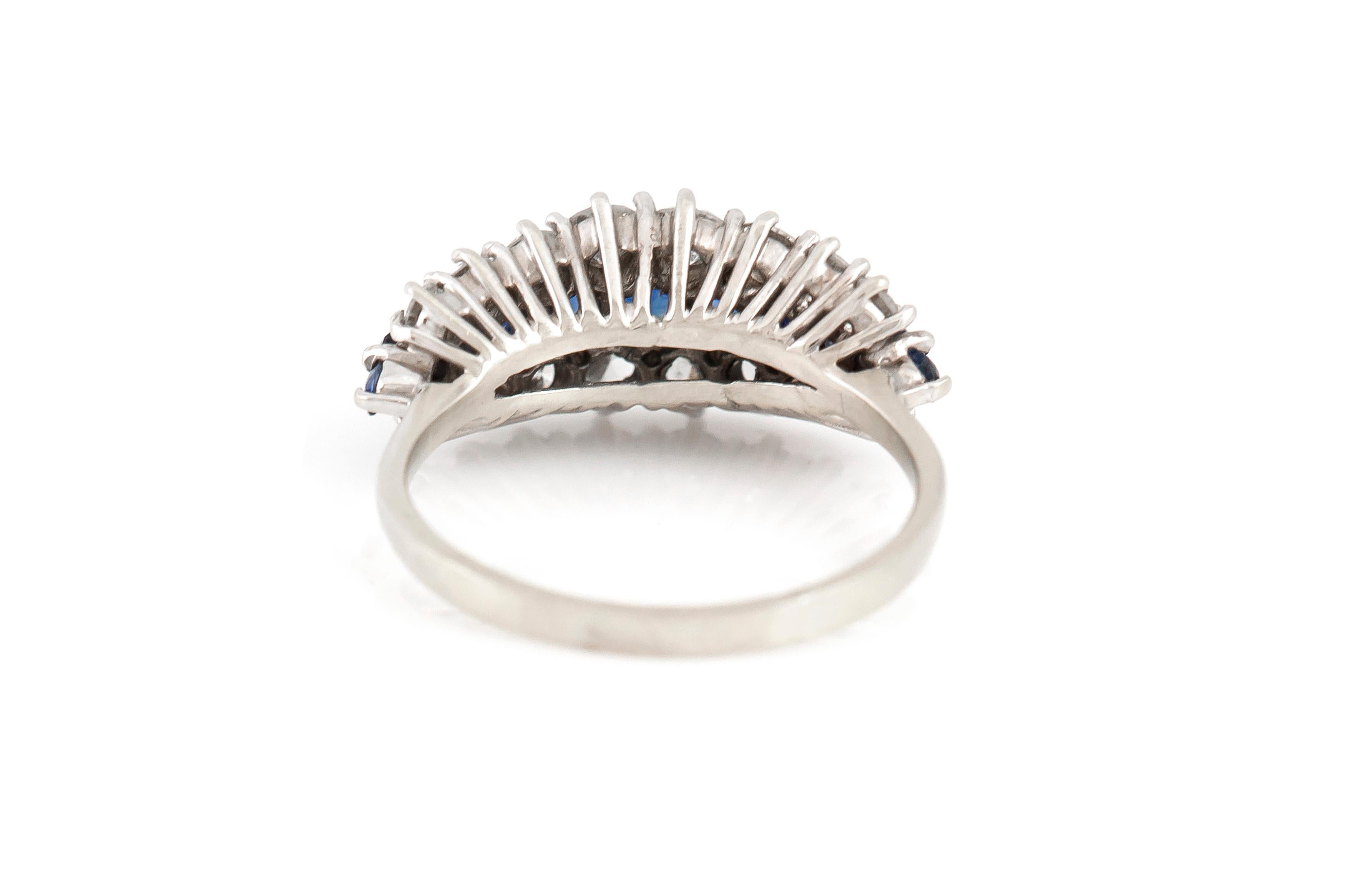 The ring is finely crafted in 18k white gold with sapphires weighing approximately total of 1.50 carat and diamonds weighing approximately total of 1.40 carat.