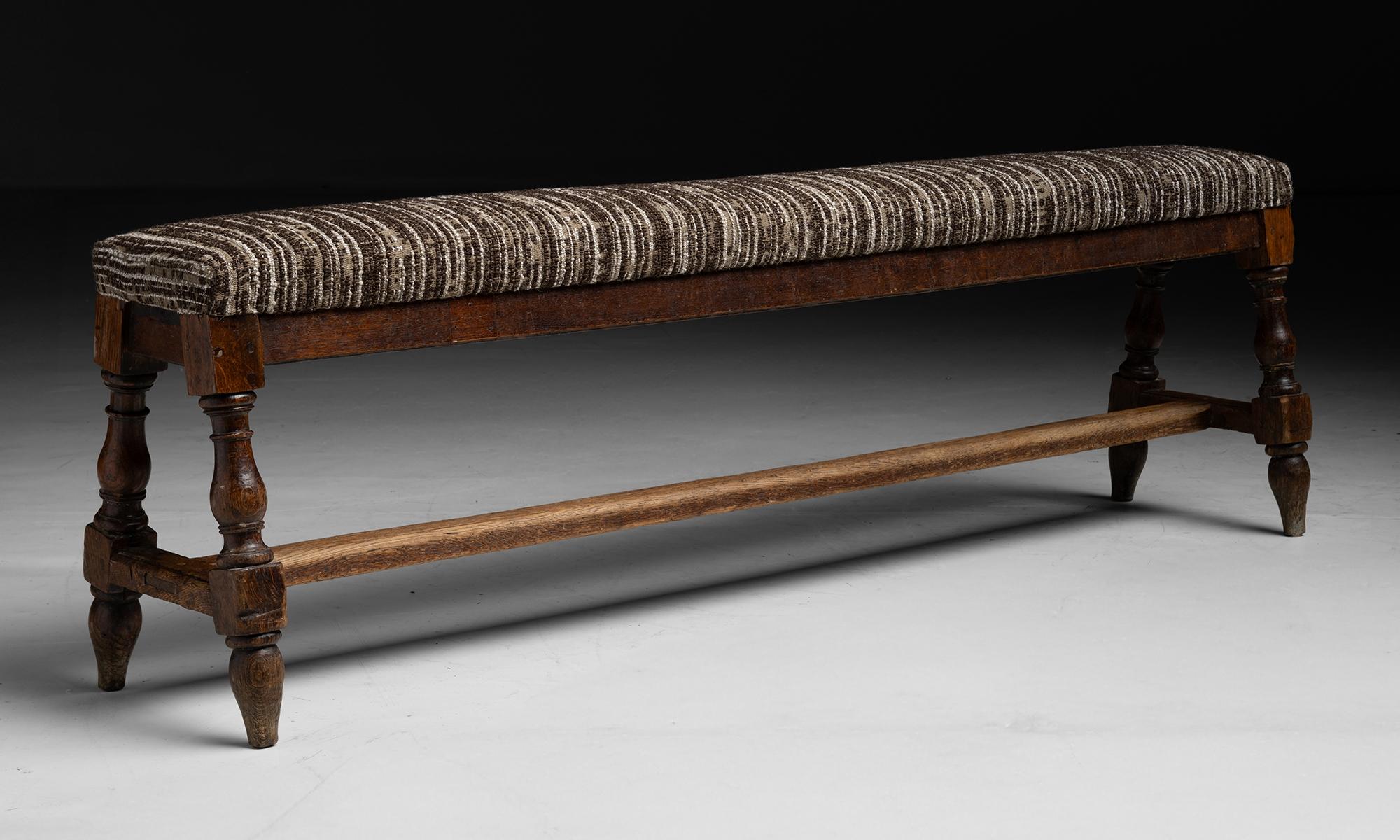 Hall Bench in Wool Blend
England circa 1890
Antique frame with turned legs, newly upholstered in wool blend by de la Cuona.
76”L x 16”d x 23”h