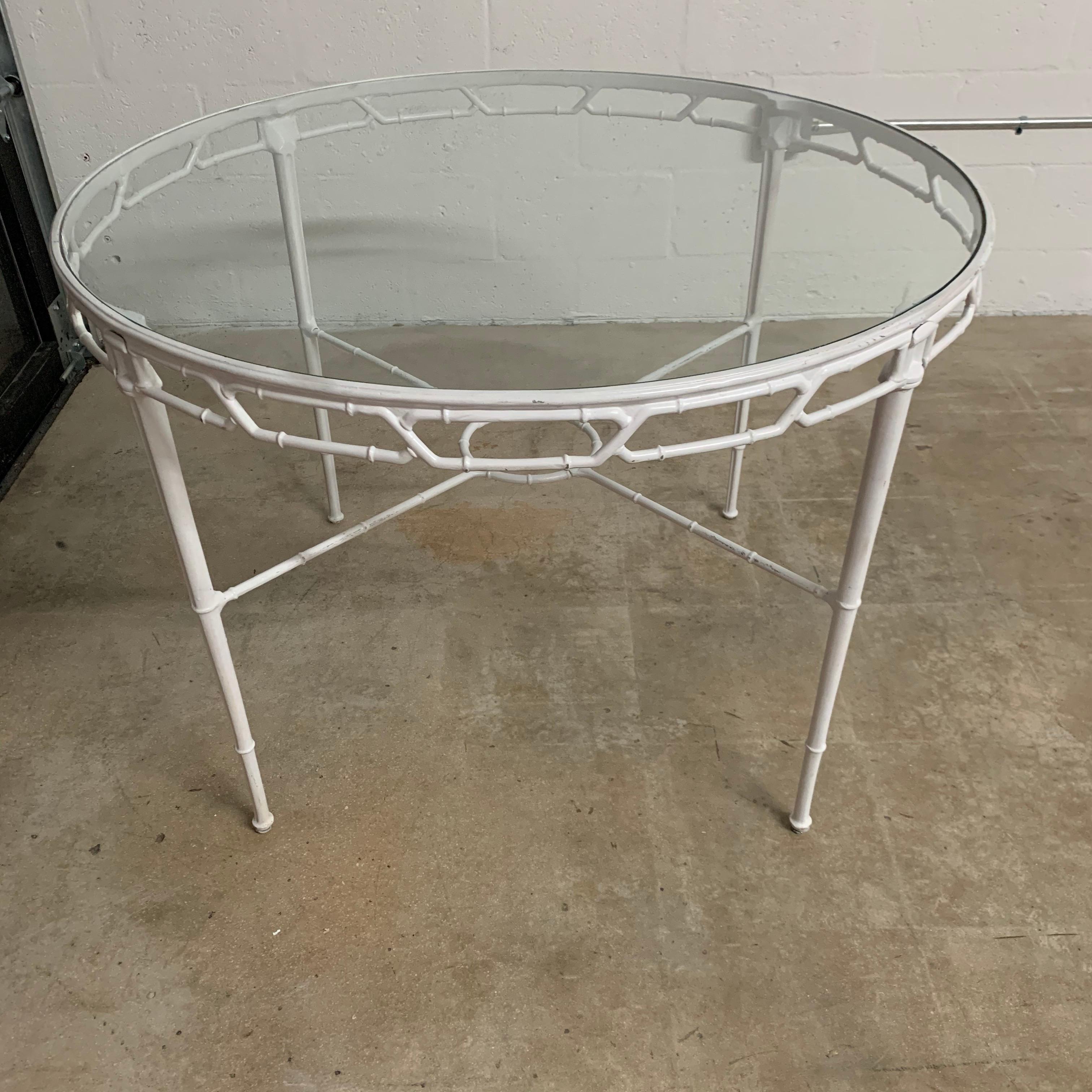 Classic Chinese Chippendale faux bamboo dining table for outdoor, garden, or patio rendered in original white powder-coated cast aluminum with a glass top. Designed by Hall Bradley for Brown Jordan, 1967.

Larger Oval Dining Table also available.
  