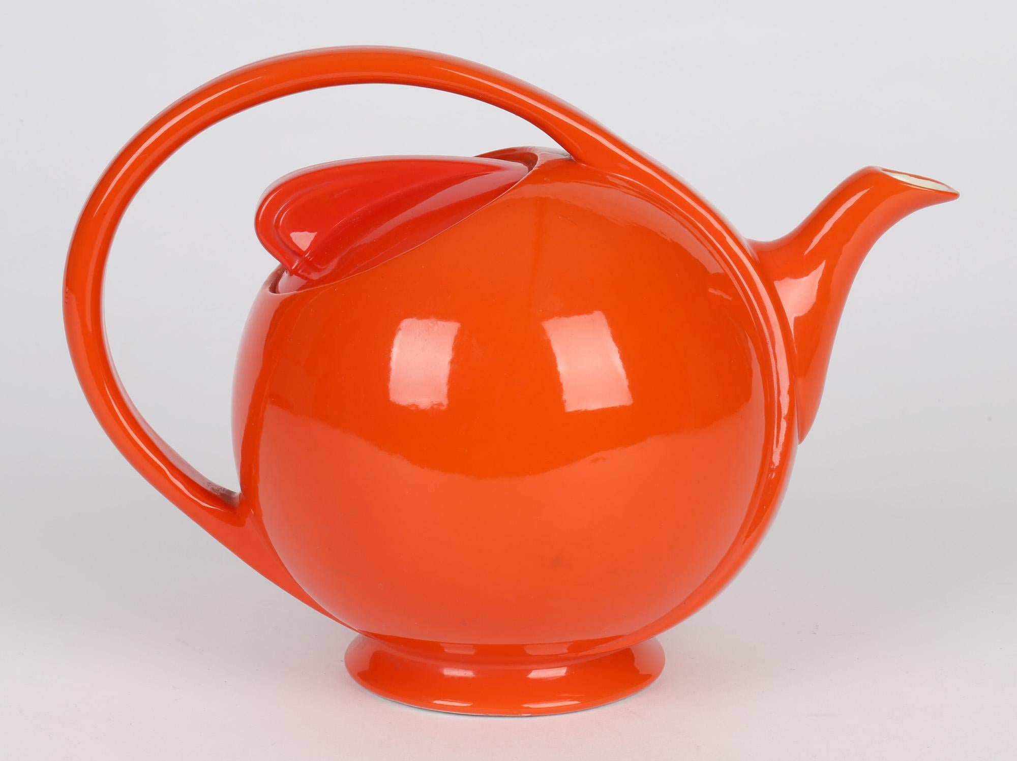 Mid-20th Century Hall China Company Art Deco Orange Glazed Airflow Shape Lidded Teapot