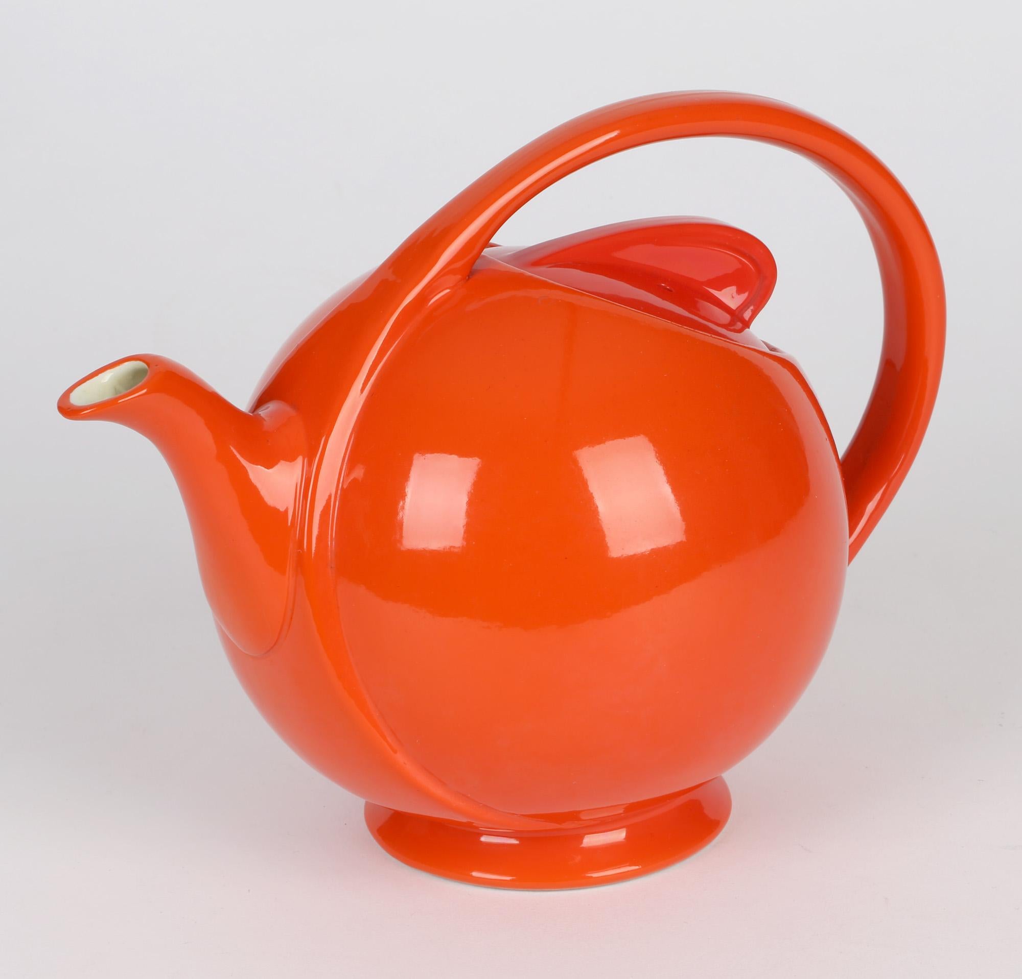 Earthenware Hall China Company Art Deco Orange Glazed Airflow Shape Lidded Teapot