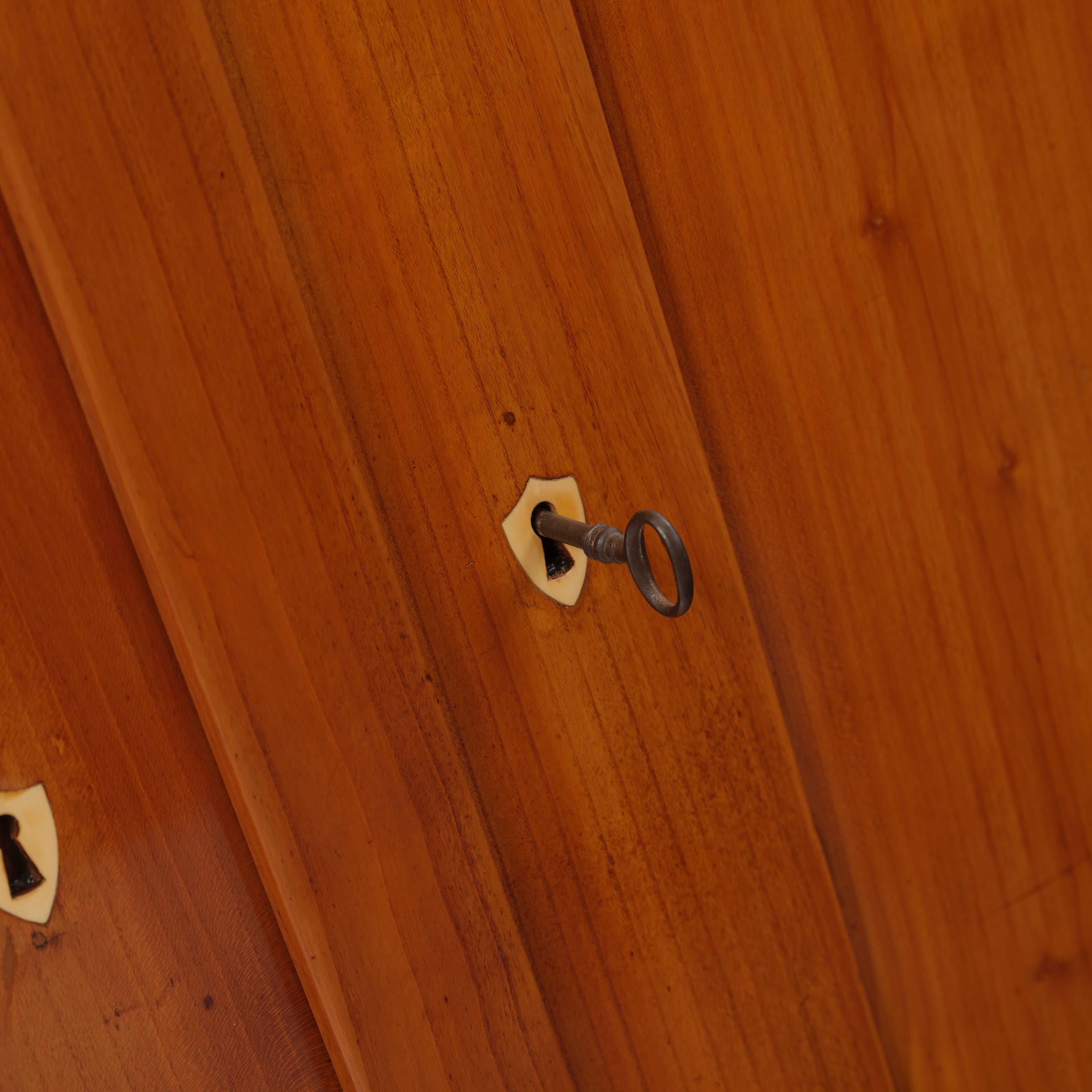 German Hall cupboard . Biedermeier, Rhineland, around 1825 Cherrywood For Sale