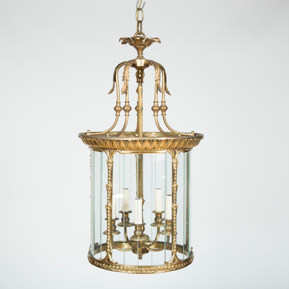 A gilt brass circular hall lantern.

5 lights to interior.

Vertical strip glazing.