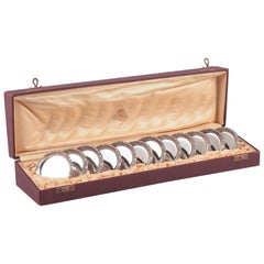 Hallberg, Royal Swedish Court Supplier. Twelve glass coasters in silver.