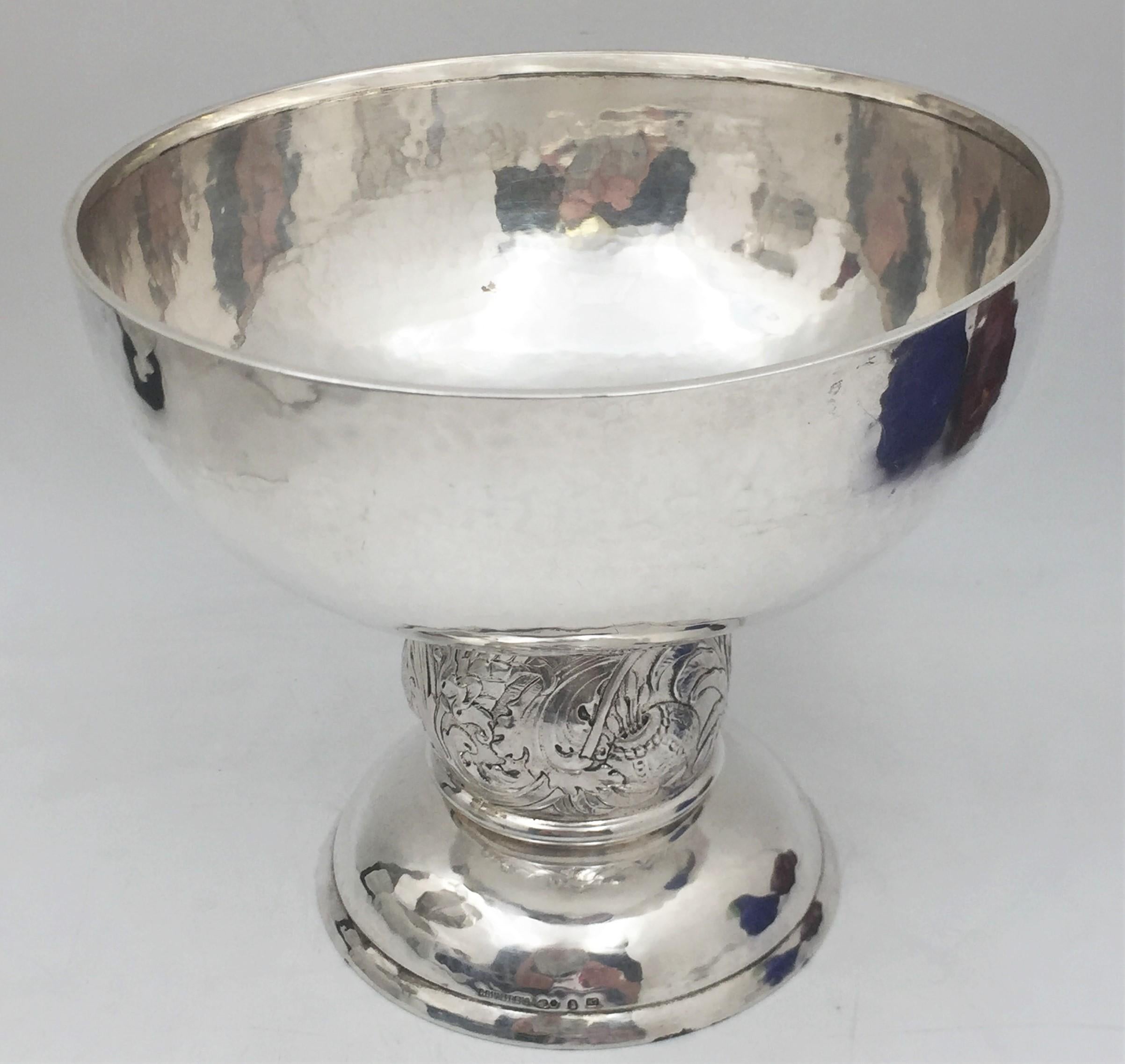 C. G. Hallberg, Swedish silver compote bowl from 1919, beautifully hand hammered and in Art Nouveau style with curvilinear, natural motifs in relief adorning the stem of the compote. It measures 6 1/2'' in height by 7 1/4'' in diameter, weighs 17.2
