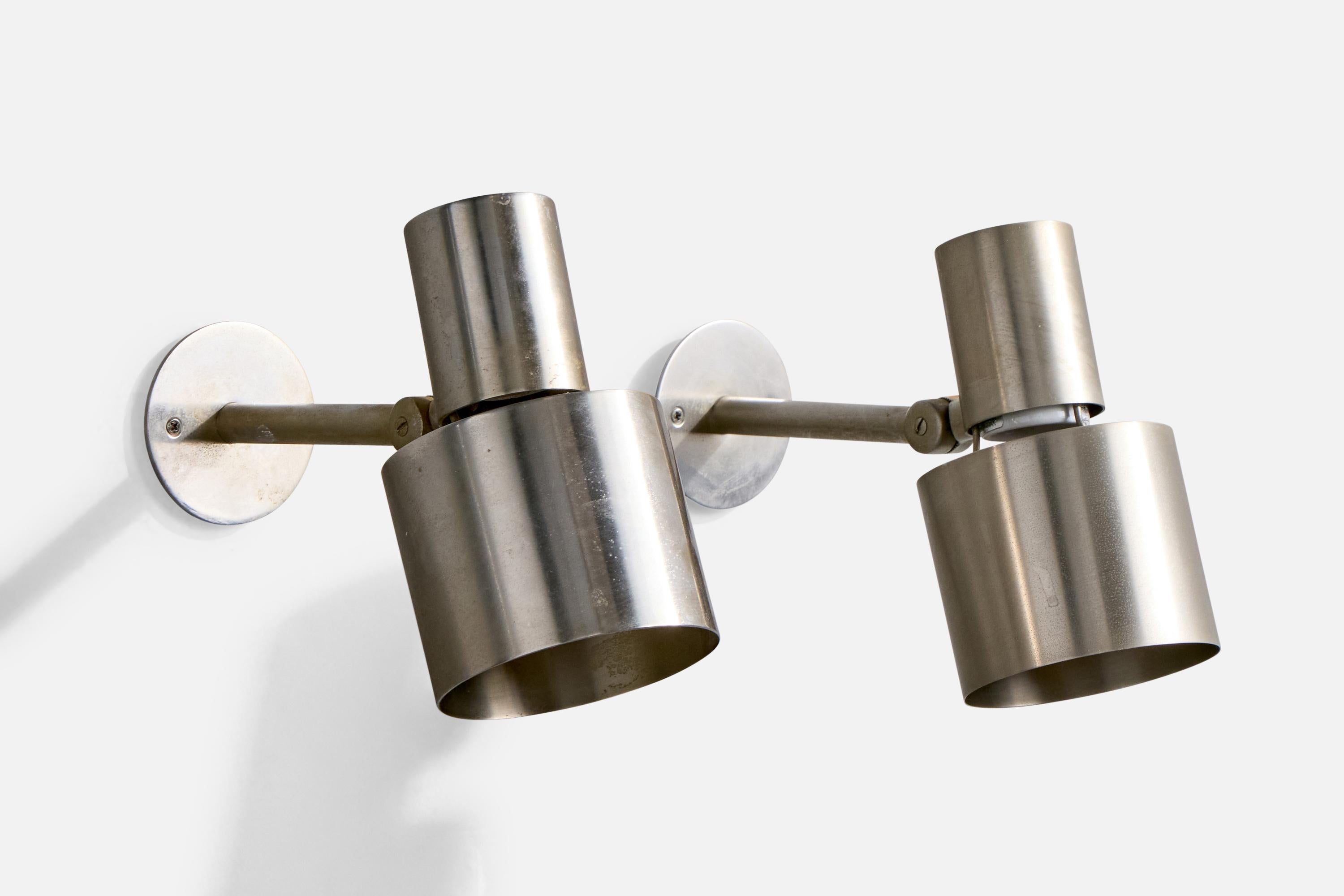 A pair of adjustable steel wall lights designed by Halldor Gunnløgsson and produced by Louis Poulsen, c. 1958

Overall Dimensions (Inches): 7.375” H x 4.1” W x 9“ D

Back Plate Dimensions (Inches): 3.2” H x 3.2“ W x .115” D

Bulb Specifications: