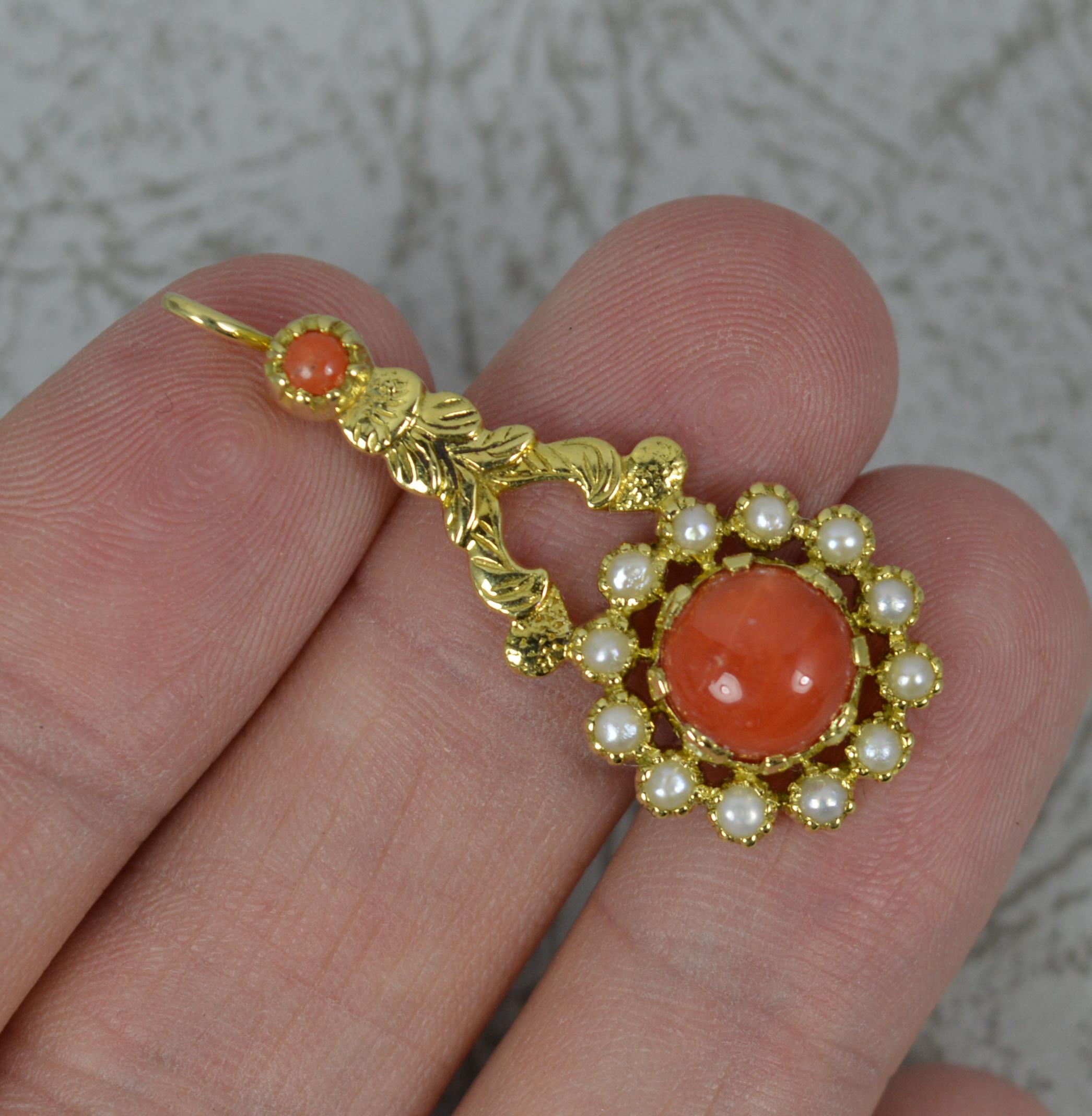 A superb quality pendant.
Designed based Georgian era Halley's Comet pieces.
Solid 18 carat yellow gold example.
Set with two coral stones and the larger with a border of pearls.
15mm x 31mm approx without bale.

CONDITION ; Excellent. Crisp design.