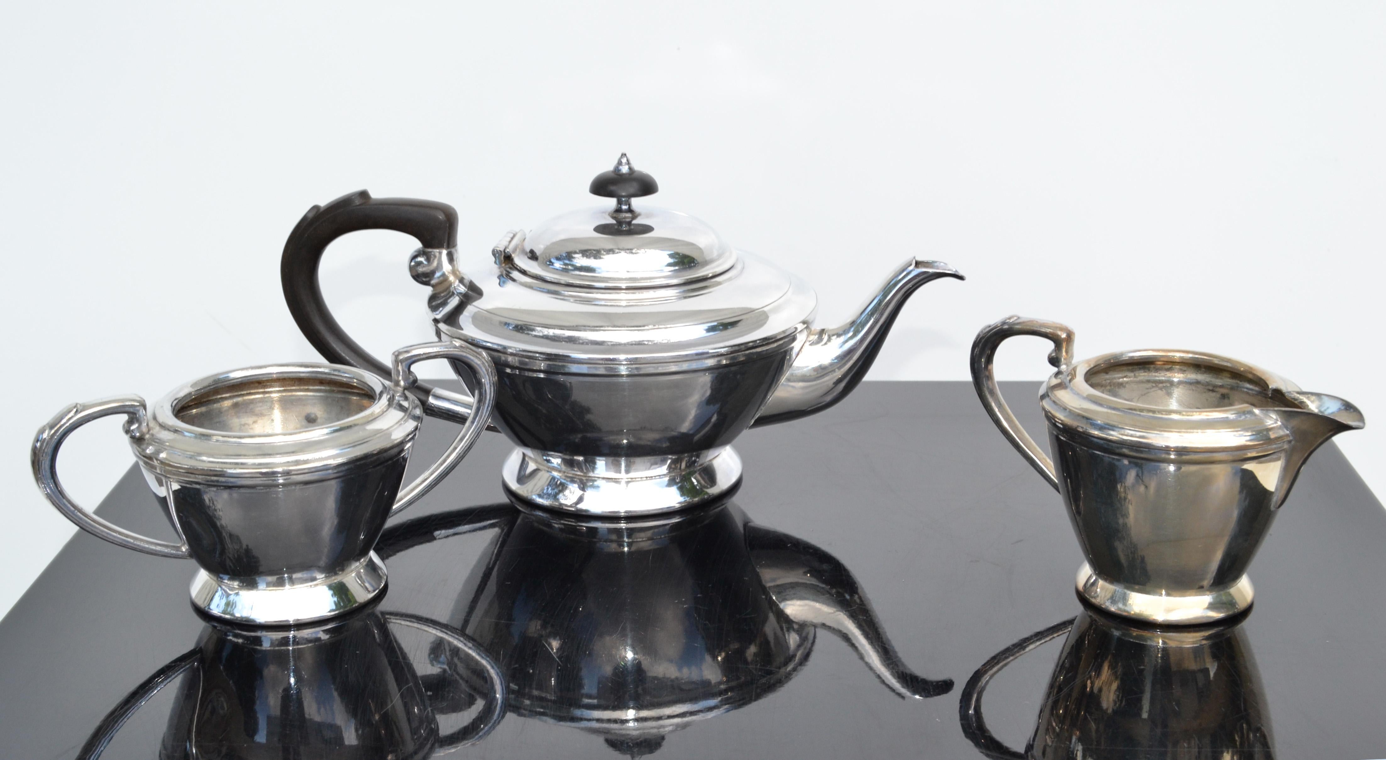 Circa 1930s, this silver service was made in England. All piece are signed with hallmarks. Features George I Style detailing. 
Bakelite Top and Handle to the Tea Pot. All pieces are marked and numbered.
Stamped:
EPBM #8181 Made in England