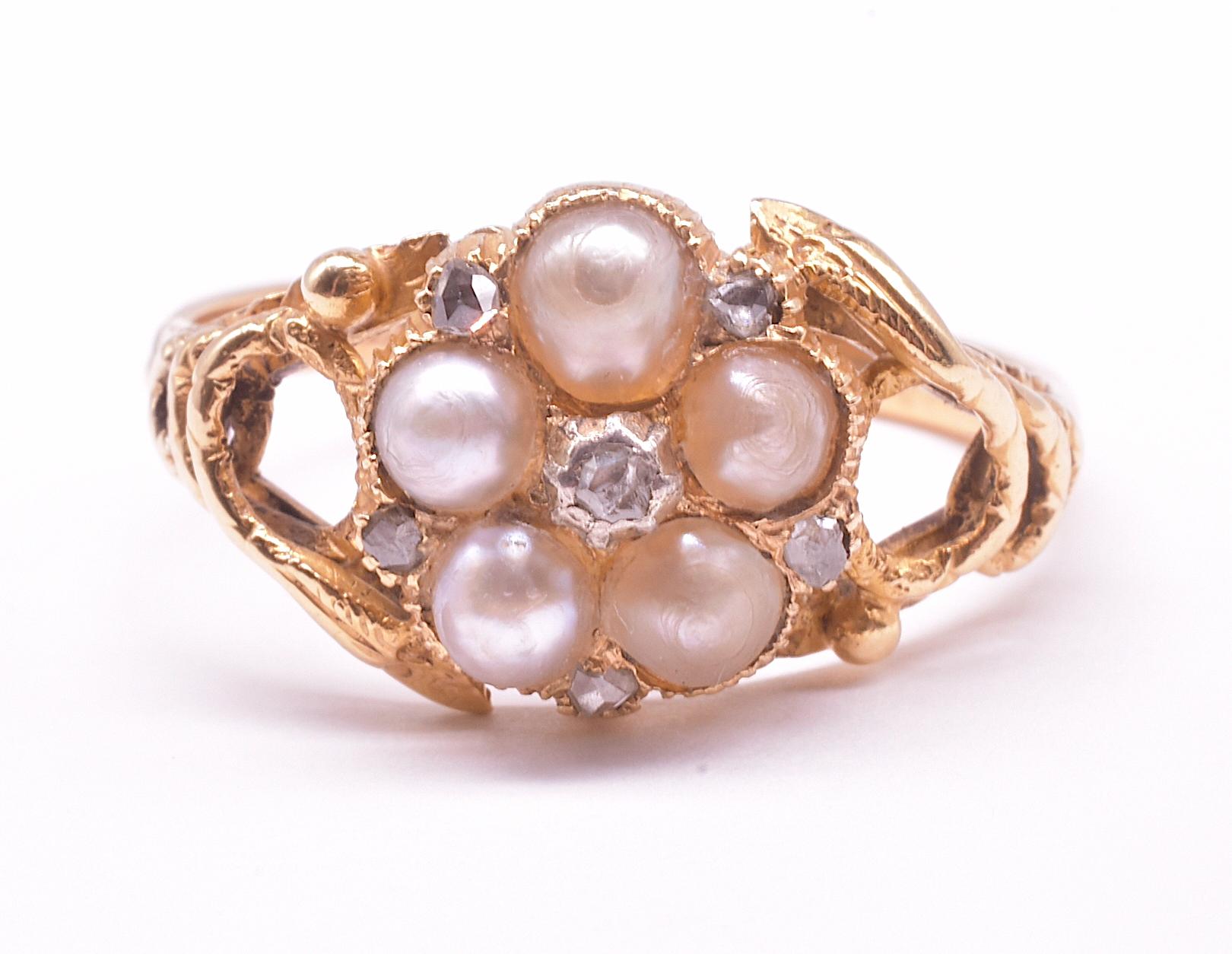 This romantic Georgian Natural Pearl Forget Me not Ring would have been given as a love ring back in its day.  With its five  pearls, it is evocative of the forget-me-not flower. A coiled serpent curls around each side of the ring enveloping their