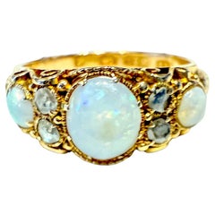 Hallmarked Birmingham 1877 15K opal and diamond 7 stone ring
