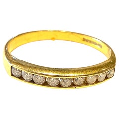 Hallmarked Glasgow 1912, 18K half hoop yellow gold ring with 9 full cut diamonds