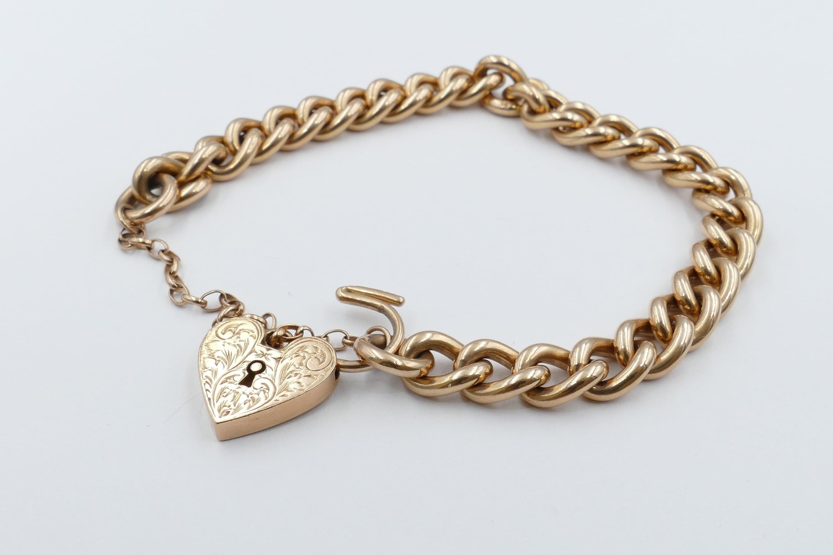 This lovely old 9ct Rose Gold Bracelet features a hallmark on each link and is in excellent condition.
Created in the late Art Deco period. 
The Bracelet measures 19cm X 8mm with a Heart Padlock and an oval safety chain and lock.
The Heart Locket is