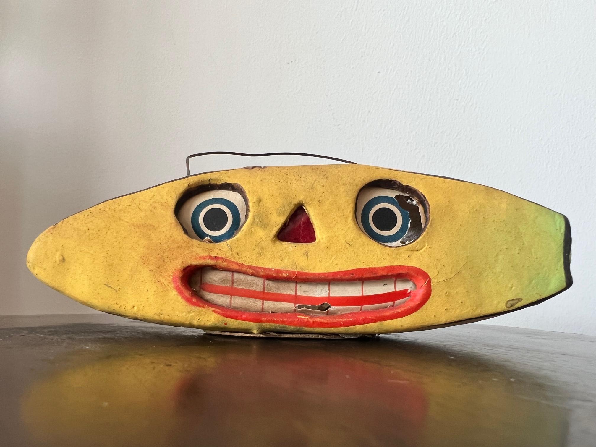 Unusual and rare halloween lantern as banana face, made in Germany, circa 1930s. Papermache with original candle inside meant to be hung. Comical and spooky-Folk Art.