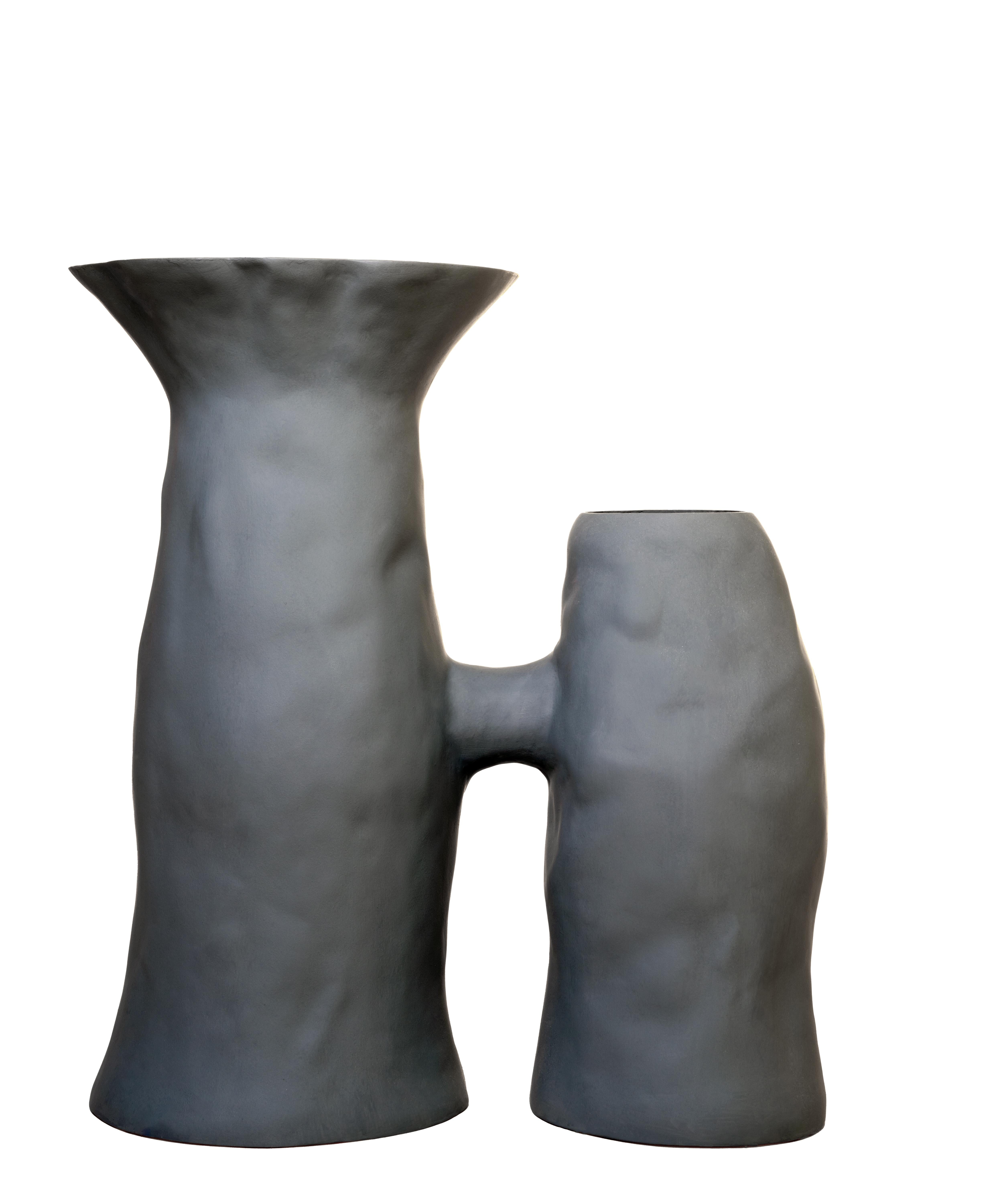Drawing inspiration from nature and ceramics, this piece evokes the columned stalks of mushrooms or tree trunks to create a functional, emotional object. The piece is comprised of two columns cojoined in a poetic embrace, one standing tall while the