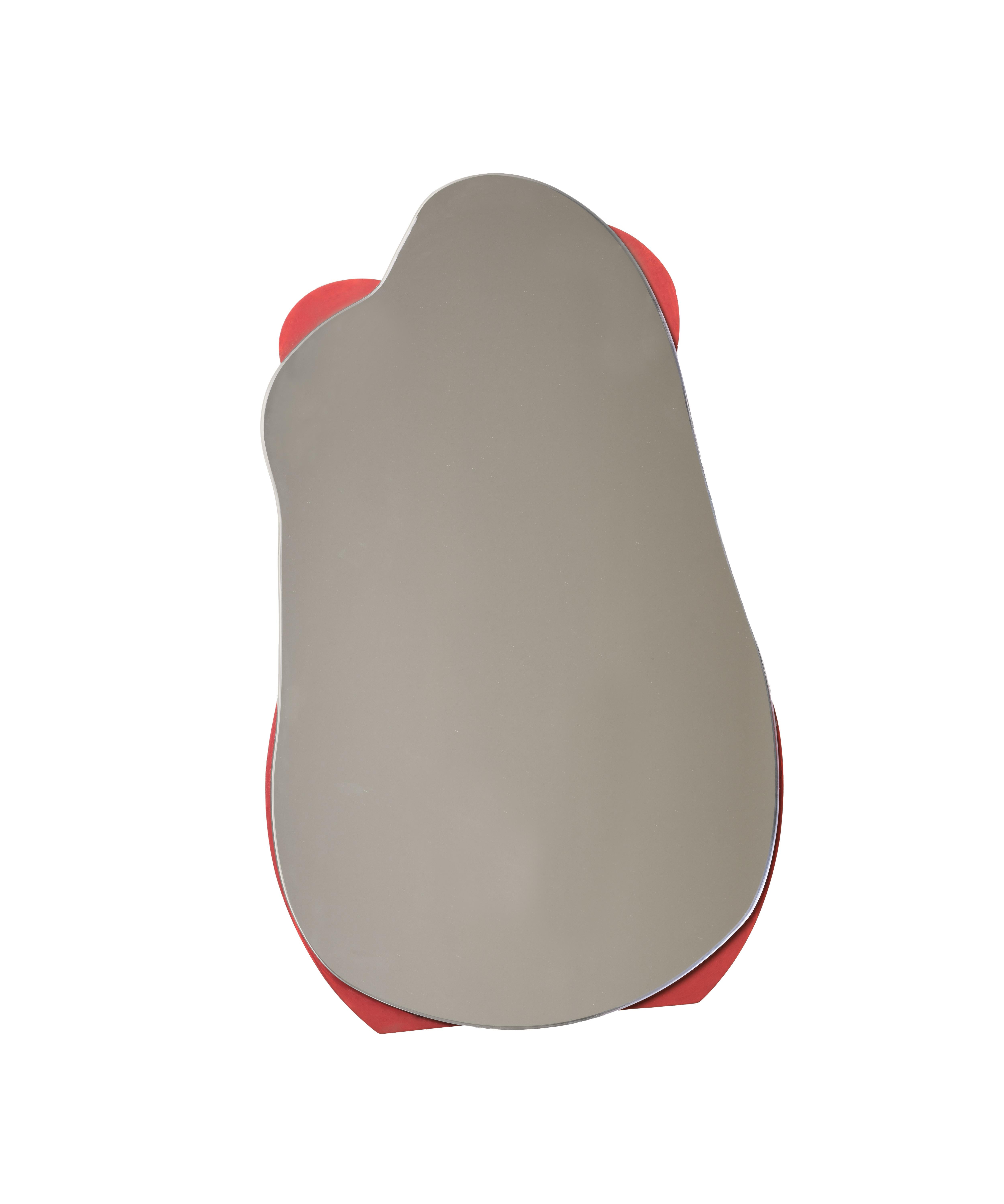 We introduce a certain fluidity to the cold, rigidity of a mirror
with this bold, colorful and vibrant piece. Almost jumping off a
wall, it cuts a curious form while functioning perfectly as an accent
mirror. This fluid fiberglass form is further