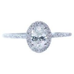 Halo 18k White Gold Solitaire Ring with 0.79 Ct Natural Diamonds, IGI Cert