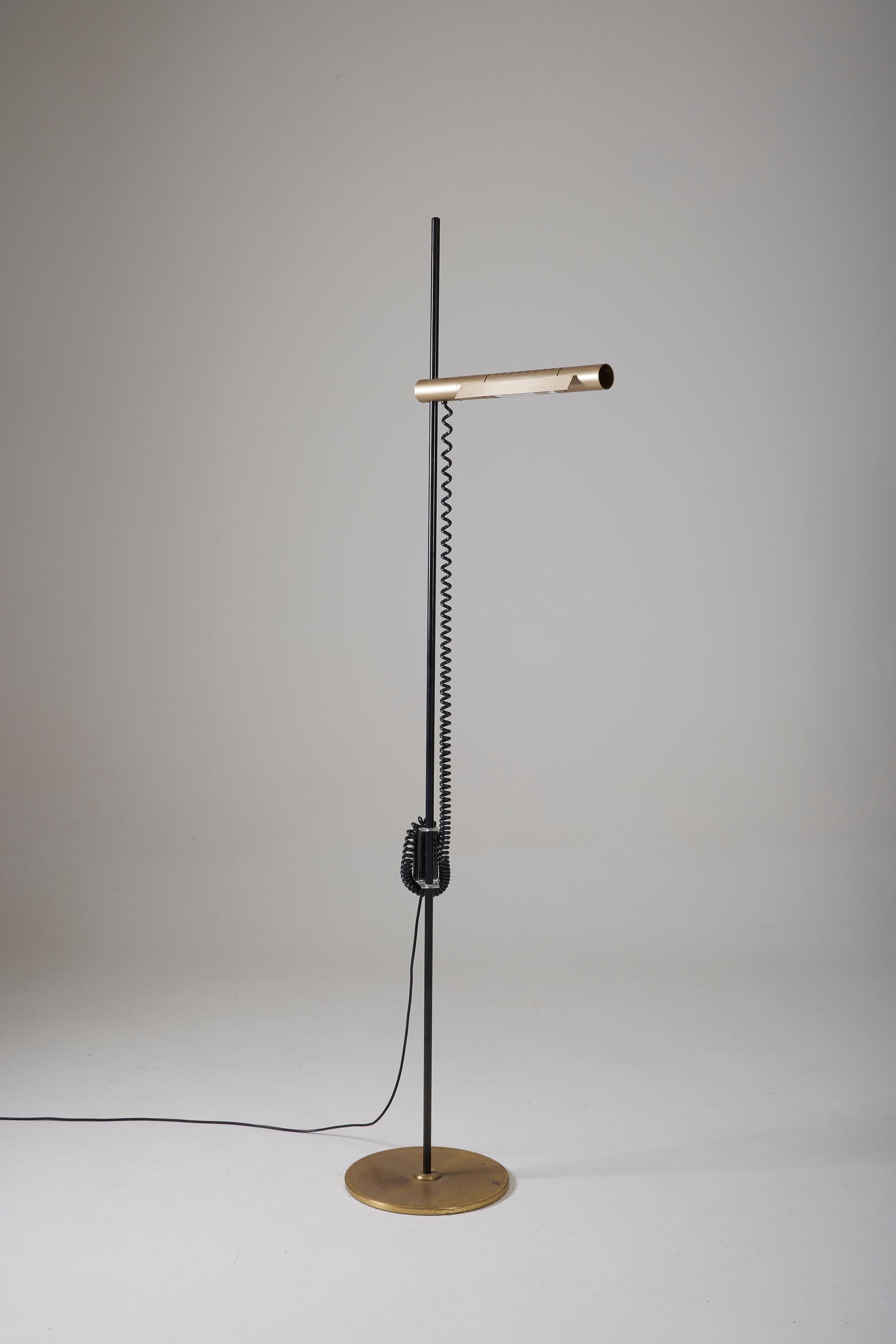 Halo 250 floor lamp by Swiss designers Rico and Rosemarie Baltensweiler for Swisslamps International, from the 1970s. Aluminum reflector and brass base. The lamp head swivels and adjusts vertically. European plug, functional electrical wiring. In