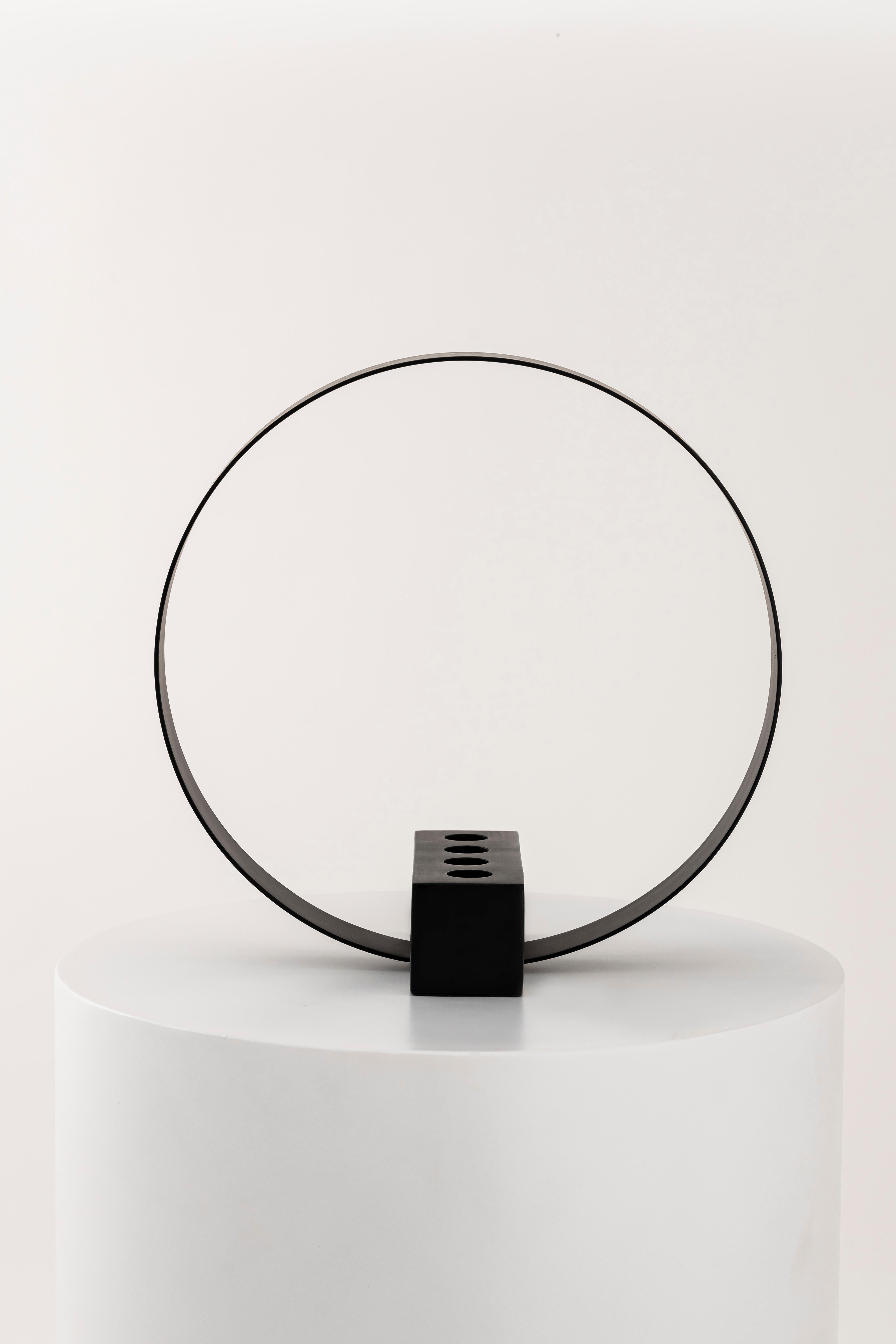 Like the glowing ring of light atop an angel's head, the Halo will light up your modern decor. The strikingly bold spherical design elevates a simple decor staple to a prominent display piece, tailor-made for a dash understated glamour. Why do we