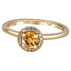 Halo Citrine Ring with Diamonds in 14 Karat Gold. 