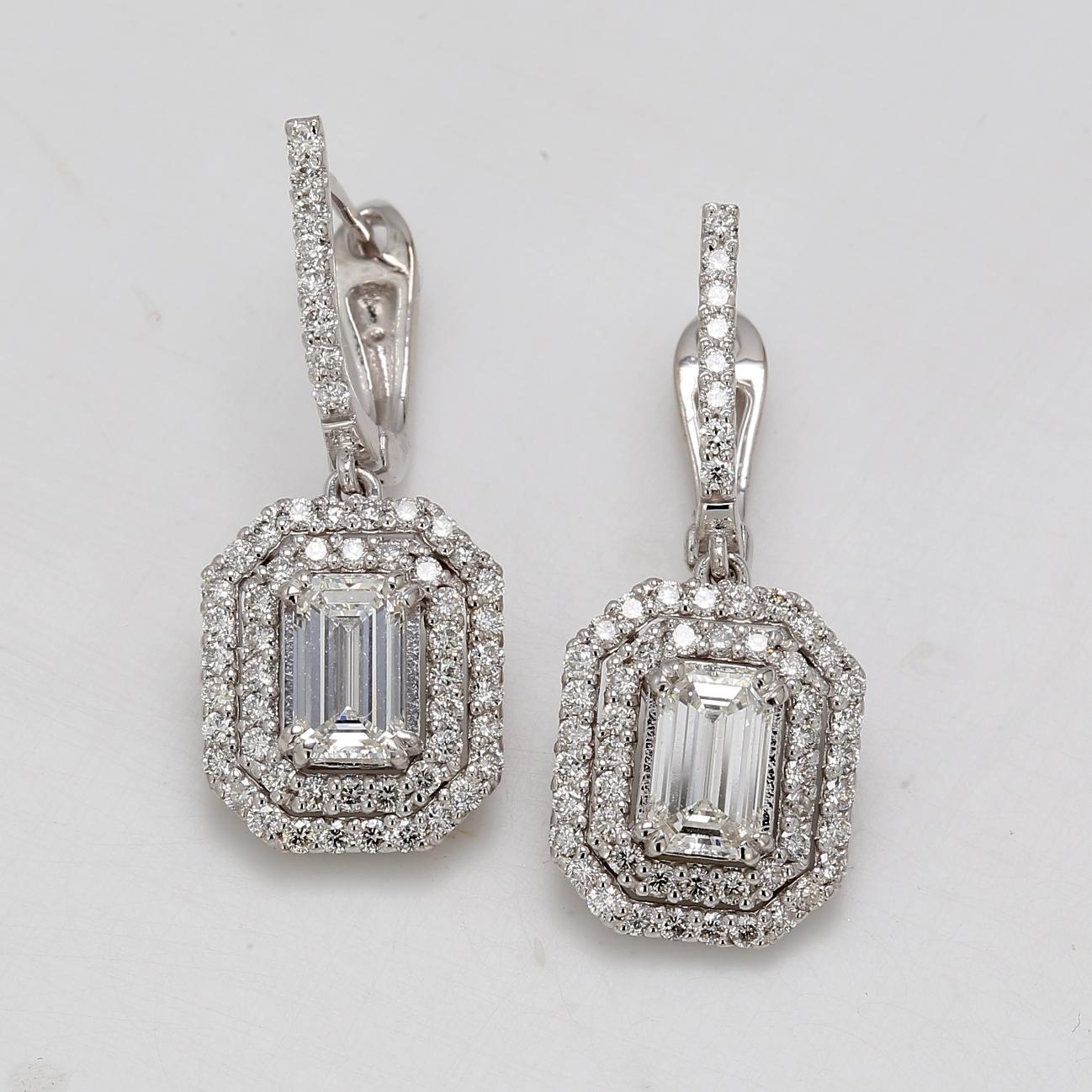 Halo dangling earrings in 14K WG with prong set rounds around prong set GIA certified J/IF and J/VS2 emerald cut diamond center stones.  D2.99ct.t.w.  (Center - 1.07 J/IF and 1.02 J/VS2)