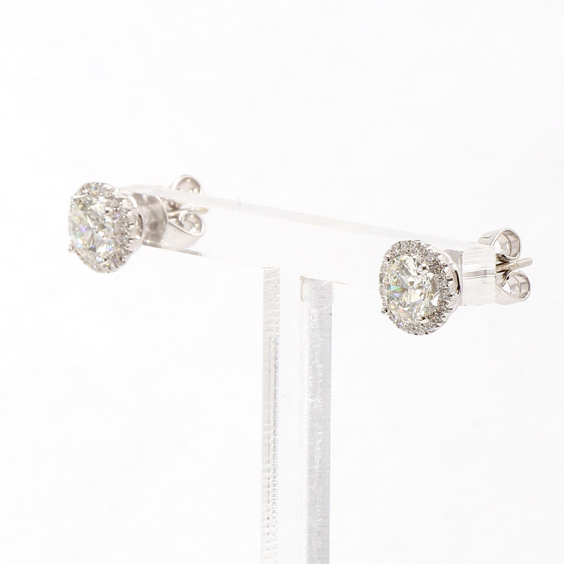 Contemporary Halo Design Diamonds Studs Earrings in 18K White Gold Diamonds. For Sale