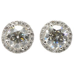 Halo Design Diamonds Studs Earrings in 18K White Gold Diamonds. Halo Design Diamonds Studs Earrings in 18K White Gold Diamonds.