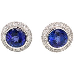 Halo Design Tanzanite Studs Earrings in 18 Karat White Gold and Diamonds