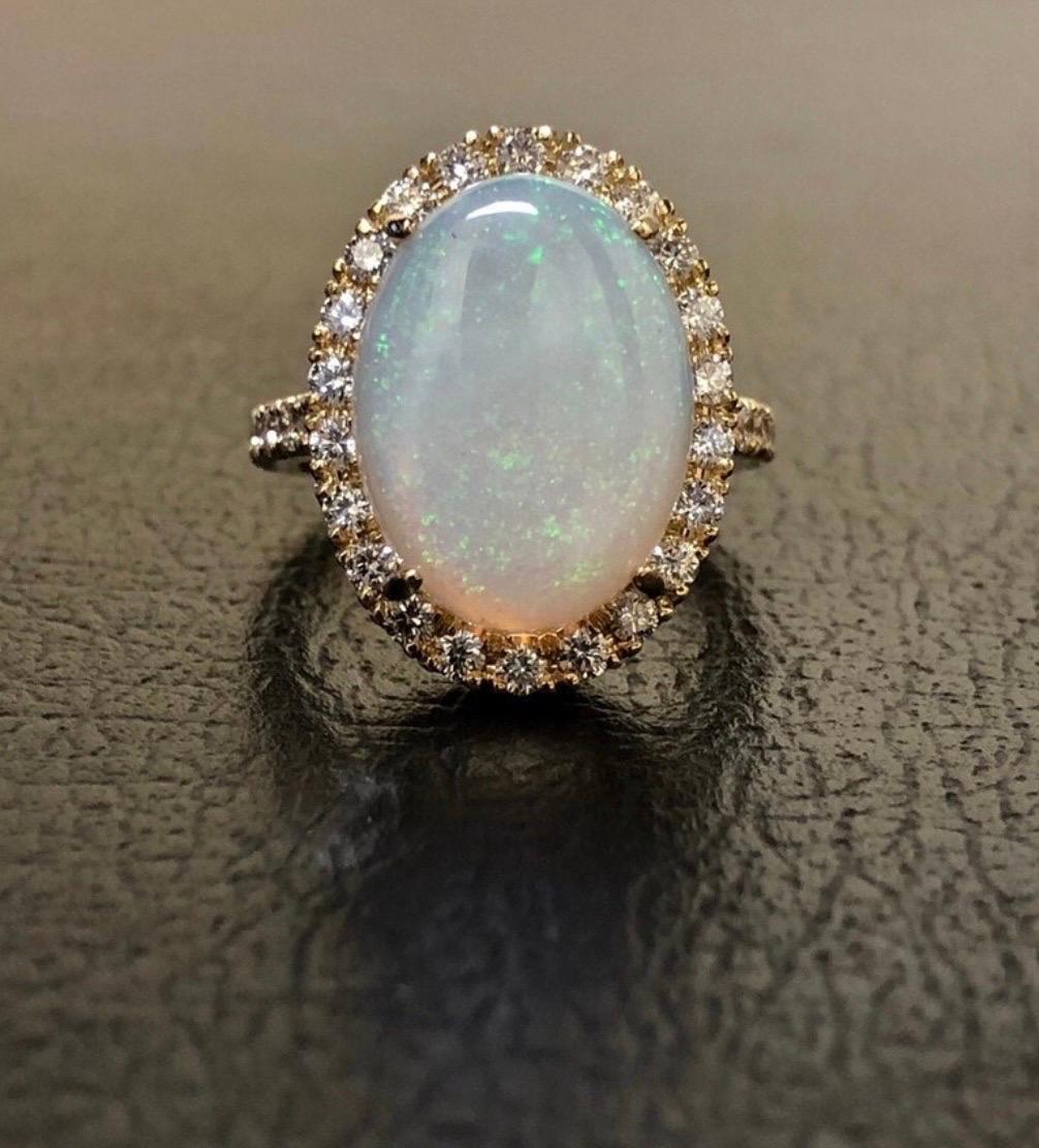 DeKara Designs Collection

Our latest design! An Elegant Art Deco Inspired Australian Opal Surrounded by Beautiful Round Diamonds in an Halo 18K Yellow Gold Setting.

Metal- 18K Yellow Gold, .750.

Stones- Center Features an Oval Fiery Australian
