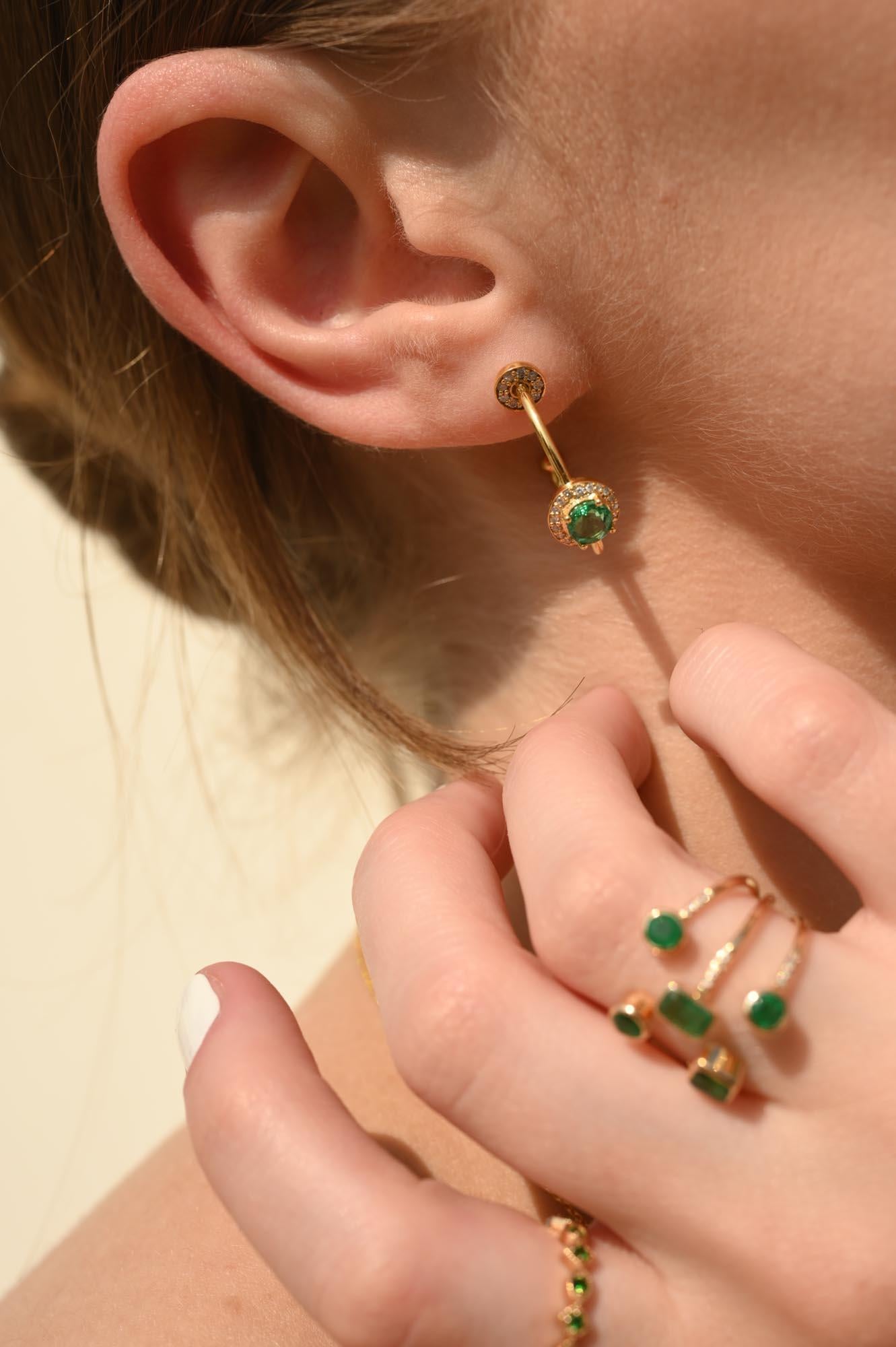Halo Diamond and Emerald C-Hoop Earrings in 14K Gold to make a statement with your look. You shall need open hoop earrings to make a statement with your look. These earrings create a sparkling, luxurious look featuring round cut gemstone.
Emerald