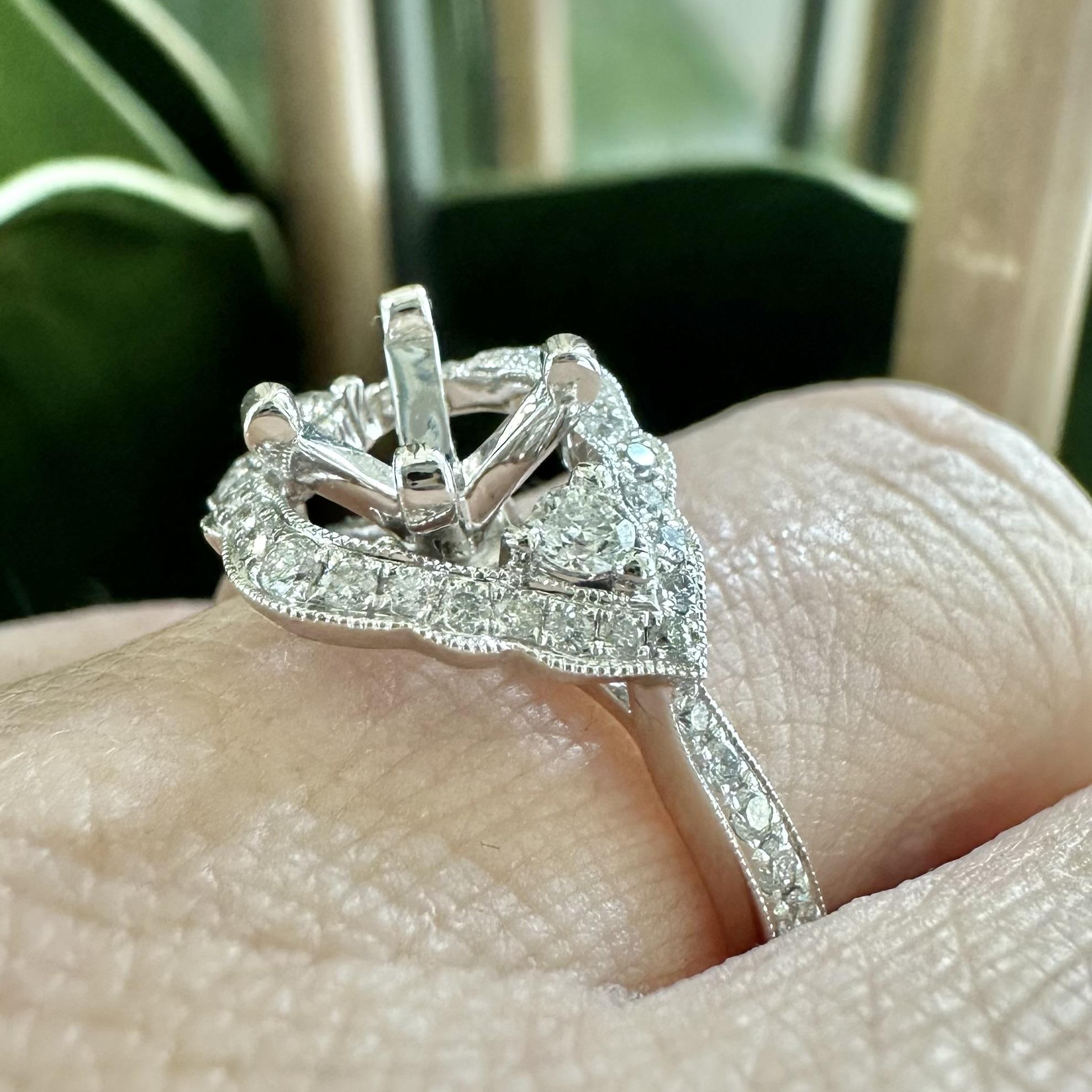Please contact us for further information.

ITEM SPECIFICATIONS:

ABOUT THE ITEM:
A ring should dazzle as much as your proposal and this gorgeous halo engagement ring is no exception. This 14k White Gold Halo Diamond Ring shines from every angle and