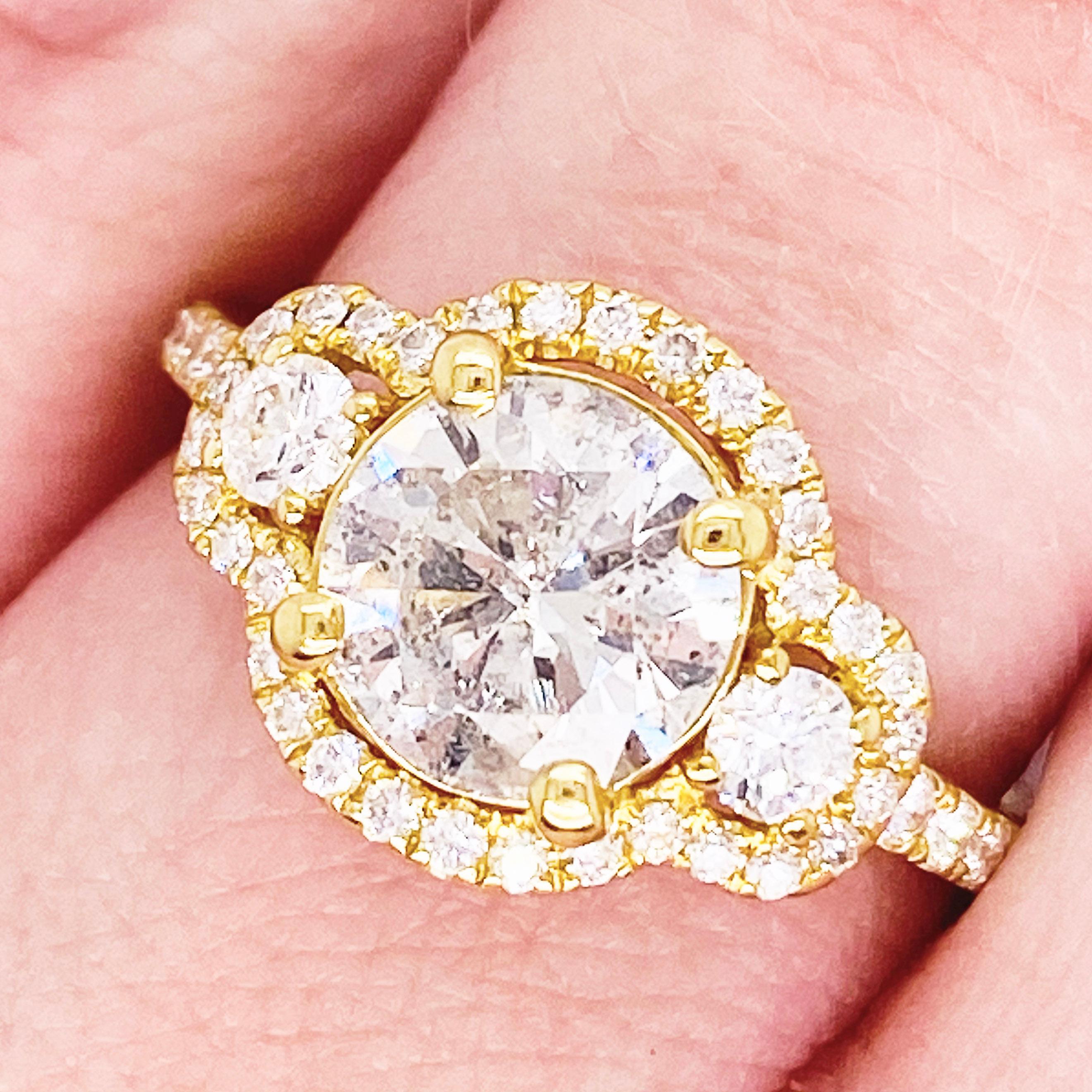 This stunningly beautiful three stone diamond engagement ring would make anyone thrilled to receive it!  These brilliant diamonds set in polished 18k white gold provides a look that is very modern and classic at the same time! This ring is very