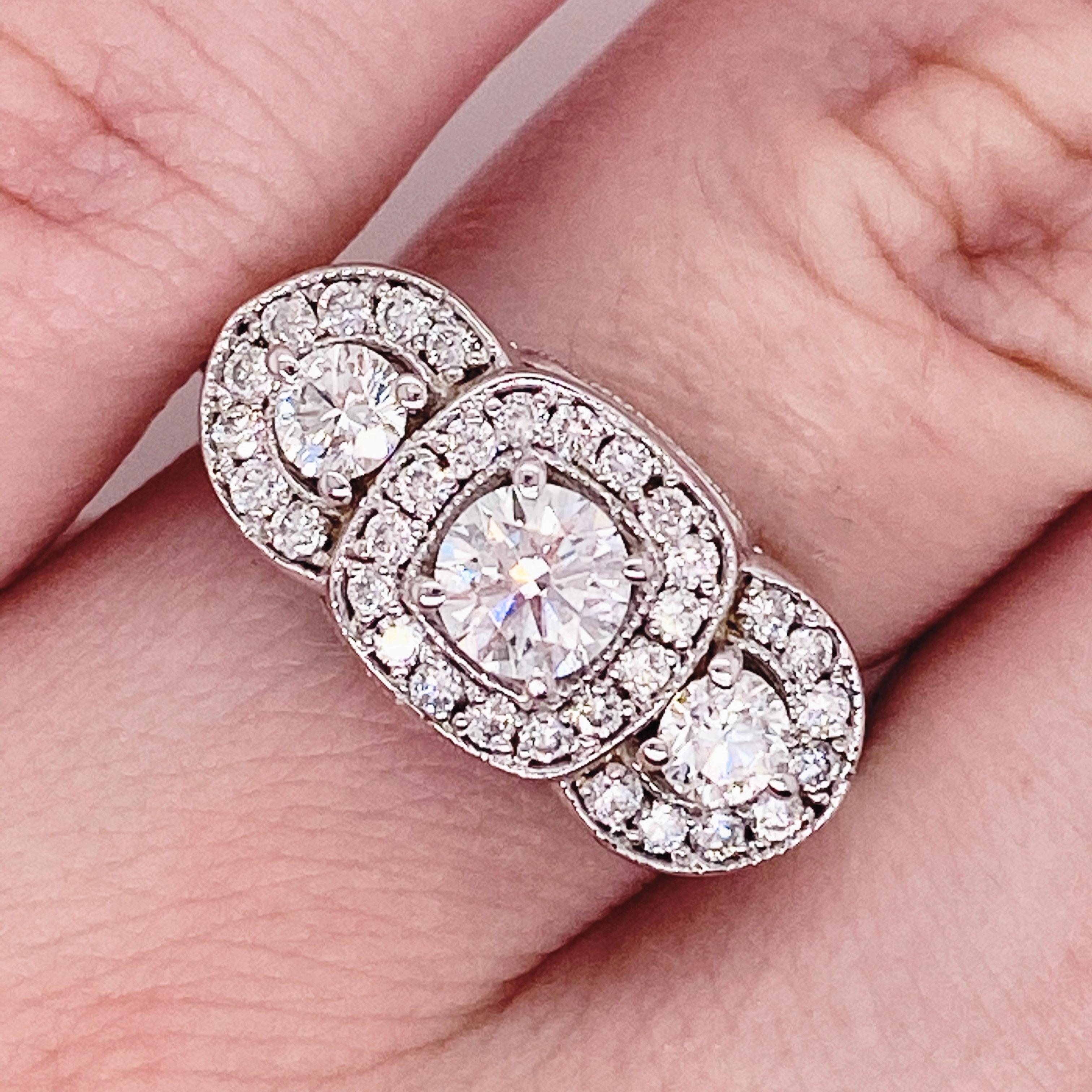 This stunningly beautiful three stone diamond engagement ring would make anyone thrilled to receive it!  These brilliant diamonds set in polished 14k white gold provides a look that is very modern and classic at the same time! This ring is very