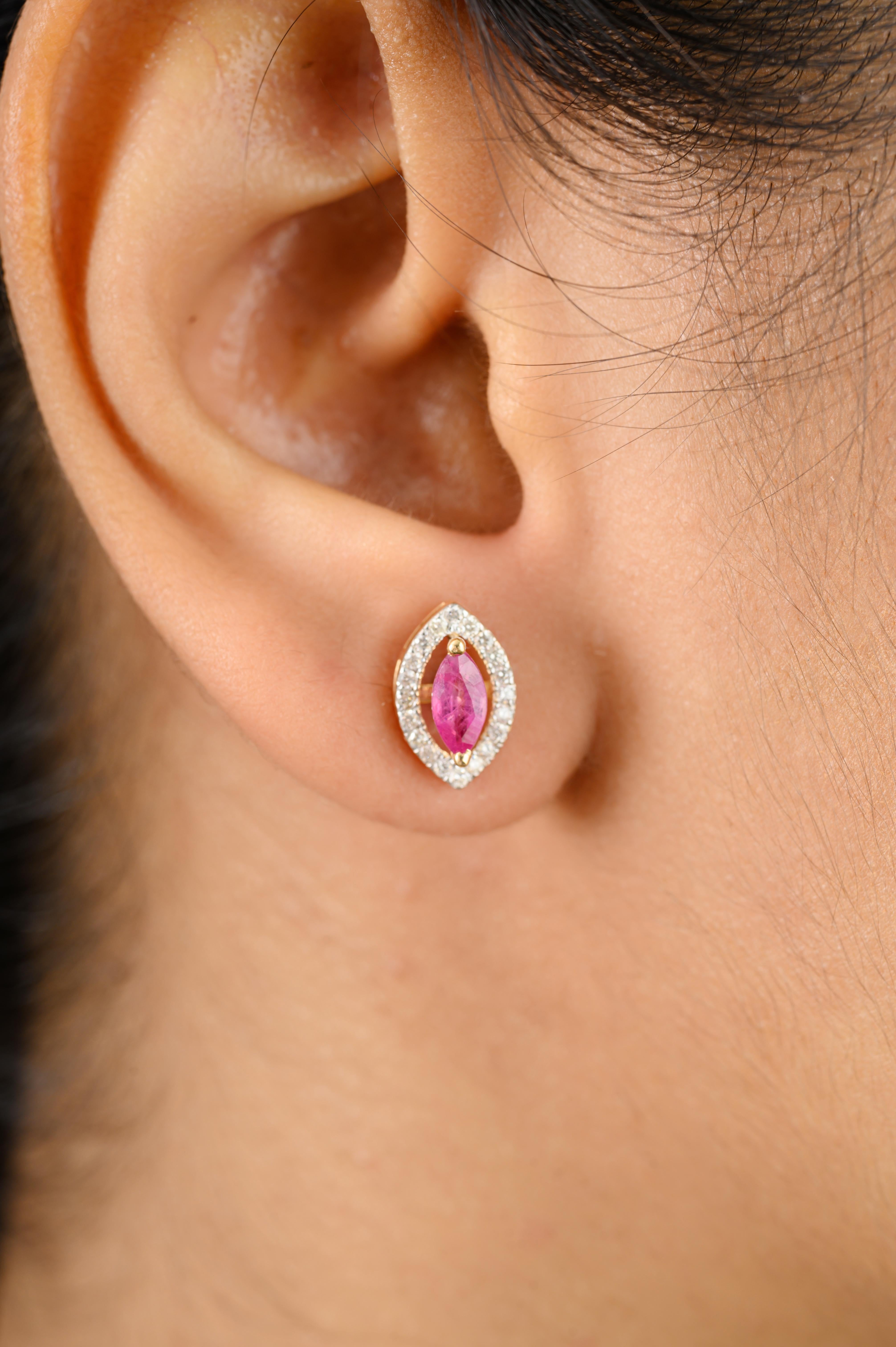 Halo Diamond Ruby Marquise Shape Stud Earrings for Her in 18K Gold to make a statement with your look. You shall need stud earrings to make a statement with your look. These earrings create a sparkling, luxurious look featuring marquise cut ruby and