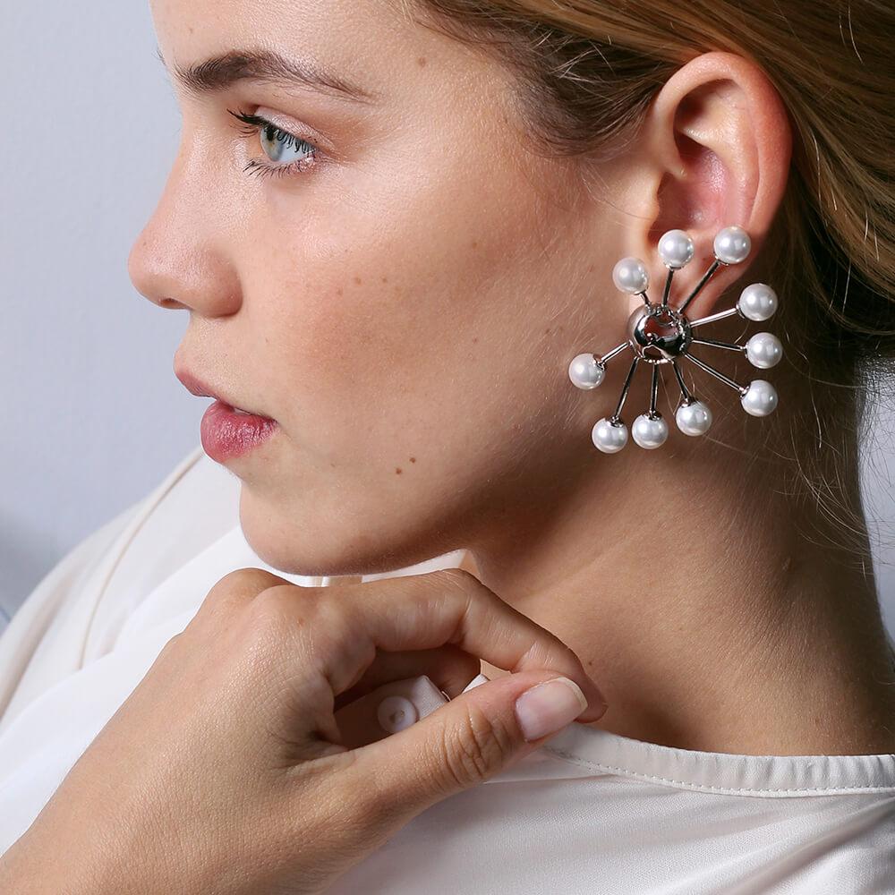 The Halo Earring design is intricately elegant yet effortlessly illustrates your passion for travel and adventure. Featuring a stunning globe pendant and 10 pearls, these earrings will certainly turn heads whenever you wear them. They are the