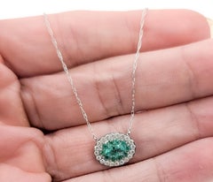 Halo Emerald and Diamond Necklace in 14k White Gold