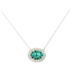 Halo Emerald and Diamond Necklace in 14k White Gold
