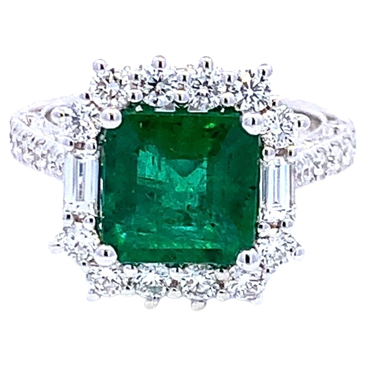 Halo Emerald Cut Ring with Diamond Baguettes