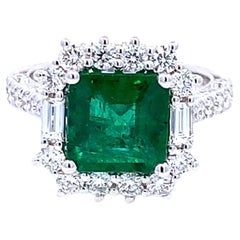Halo Emerald Cut Ring with Diamond Baguettes